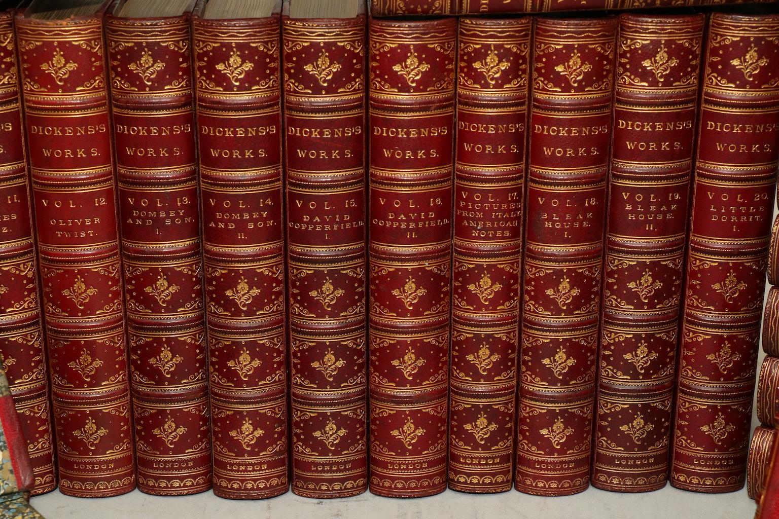 Library edition. Leatherbound. Thirty volumes. Octavo. Bound in three quarter red morocco, marbled boards, top edges gilt, raised bands, and with ornate gilt tooling on spines. Very good. Published in London by Chapman and Hall. Not dated, circa