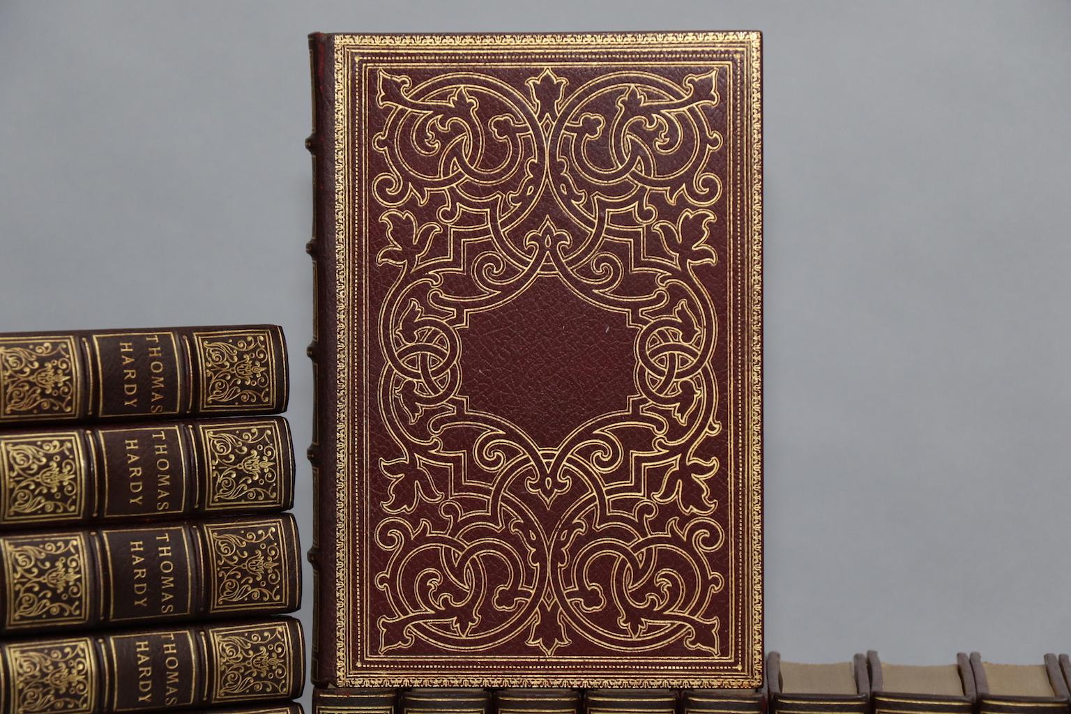 Mellstock edition. Leatherbound. Thirty-seven volumes. Quarto.
Limited to 500 sets, signed by Thomas Hardy of volume one of frontispiece. Exquisitely bound in full red morocco with top edges gilt, raised bands, and elaborate floral gilt tooling on