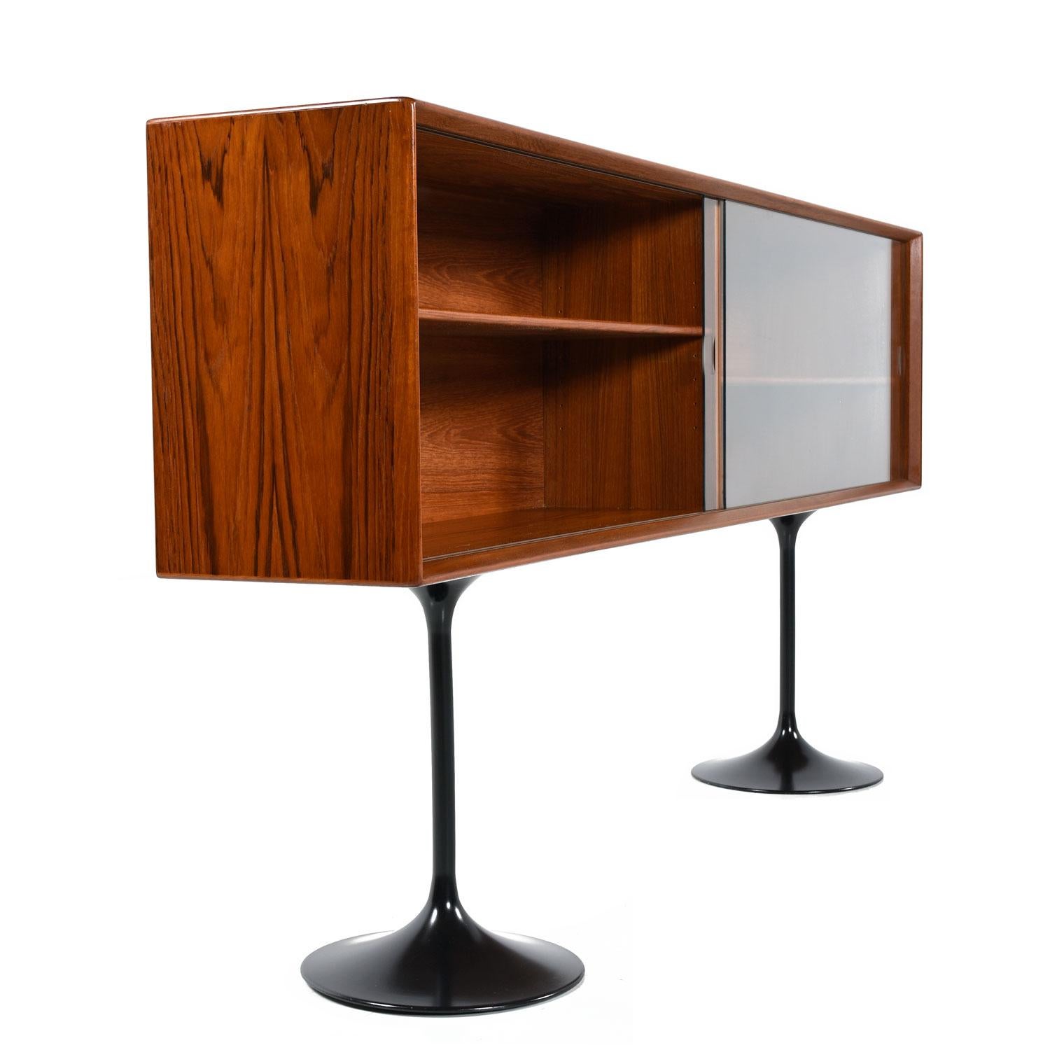 Mid-century Scandinavian Modern Danish teak bookcase console cabinet credenza by Dyrlund. Made in Denmark, vintage 1960s, teak wood construction. The unit is finished on back side and can be used as a room divider. This credenza as a prime example