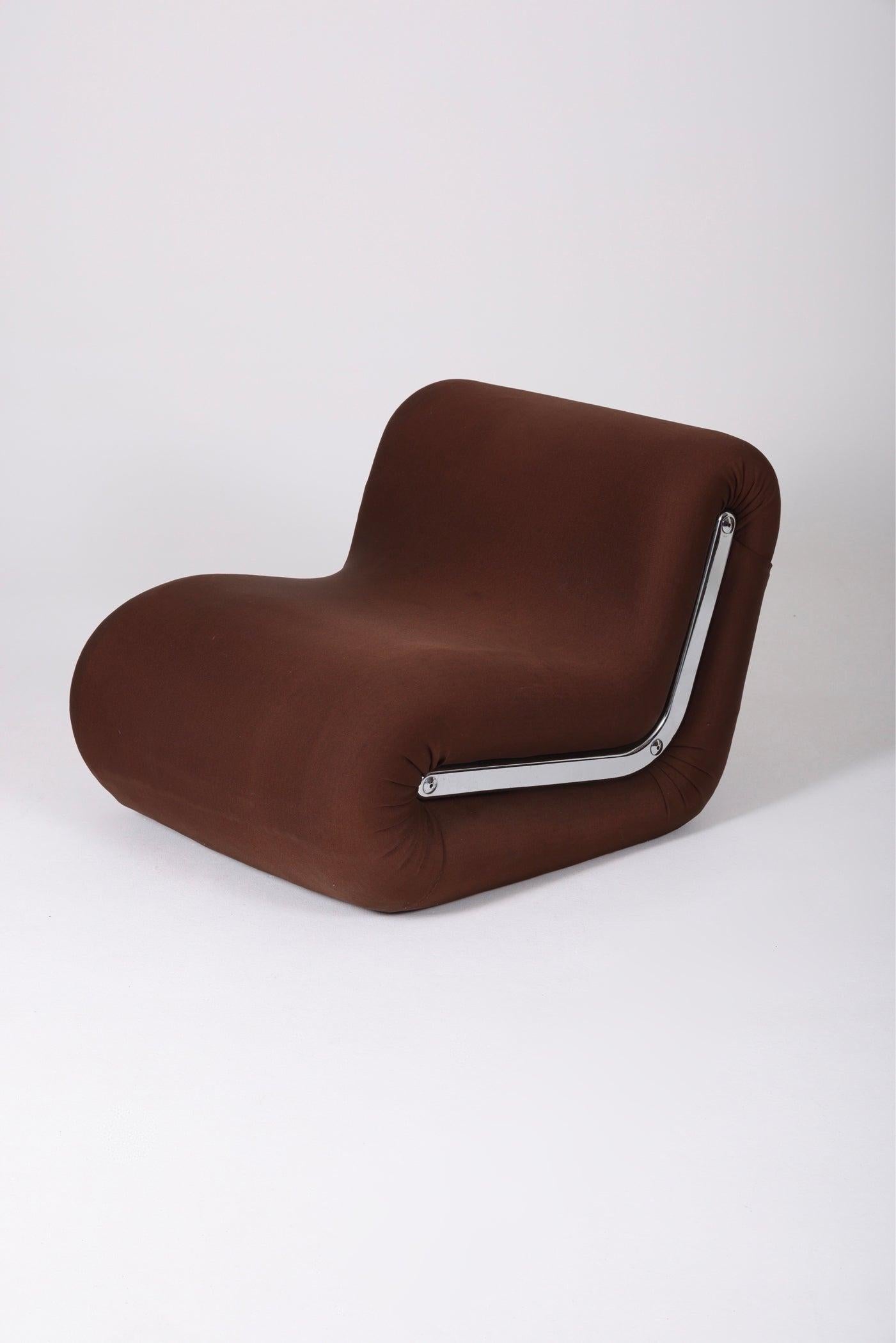 Boomerang armchair by Italian designer Rodolfo Bonetto, from the 1960s. Metal frame, brown fabric upholstery, and chrome metal detailing on each side. Some fabric tears. 
LP724