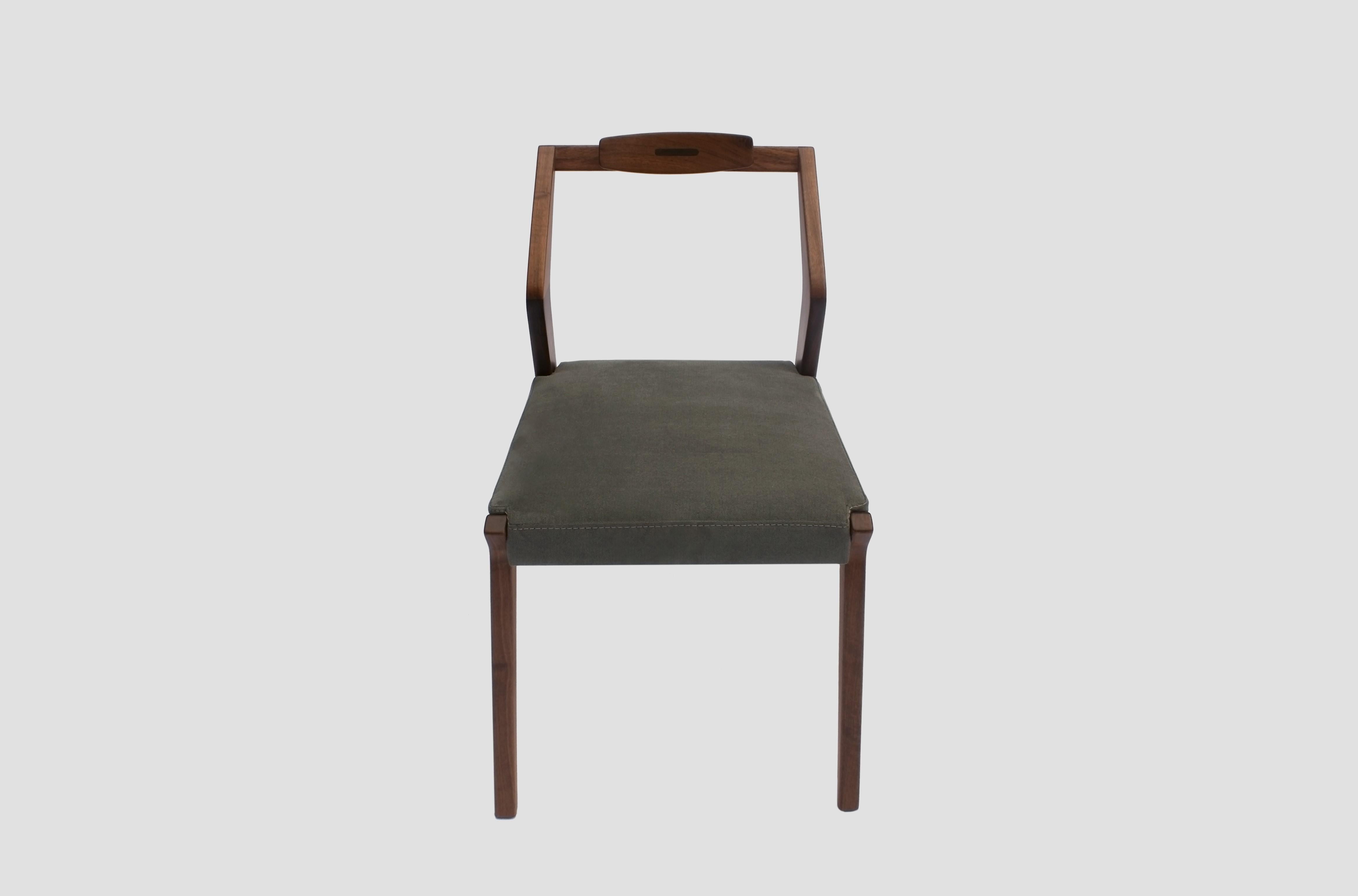 Boomerang light dining chair by Arturo Verástegui
Dimensions: D 50 x W 60 x H 85 cm
Materials: walnut wood, fabric.

Dining chair made of solid holm walnut with fabric or leather.

Arturo Verástegui has been the director and founder of Breuer