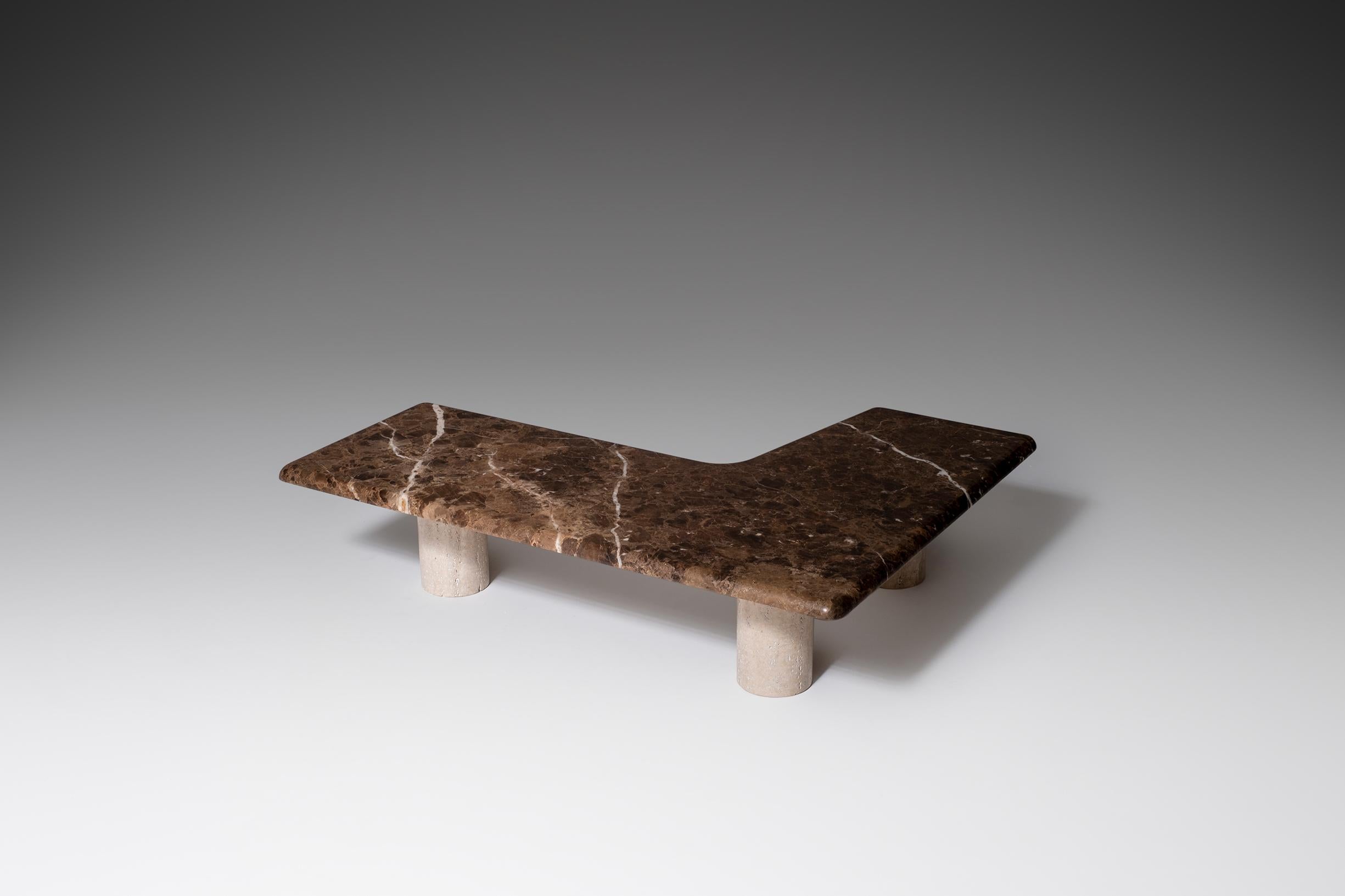 Striking large boomerang shaped coffee table, Italy 1960s. Composed of a brown coloured marble top which rests on three low cilinder shaped travertine columns. The large marble top has an interesting ‘boomerang' shaped free form with elegant curved