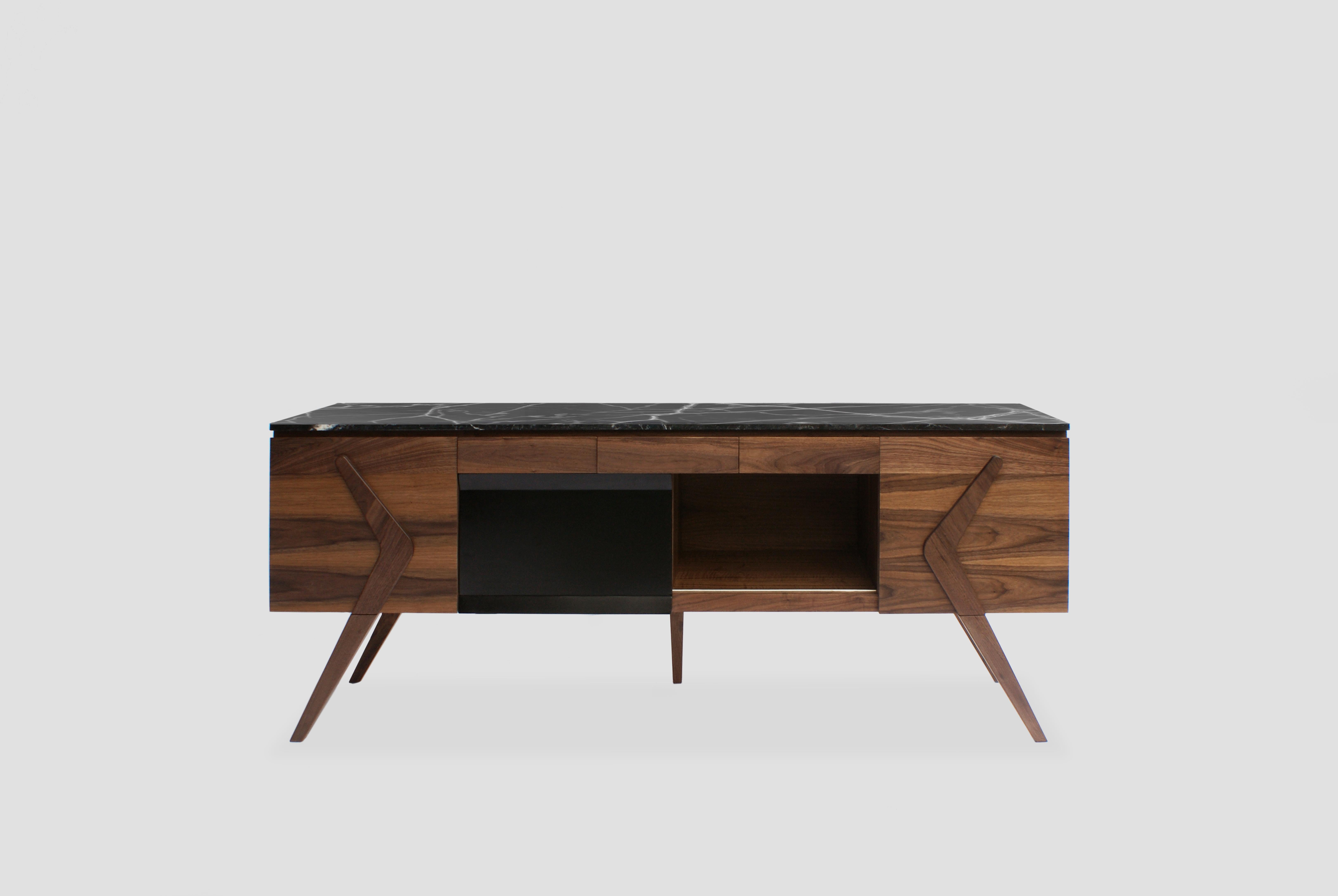 Boomerang sideboard by Arturo Verástegui
Dimensions: D 200 x W 90 x H 50 cm
Materials: walnut wood, metal, Negro Monterrey marble.

Walnut with black electro-painted metal and Negro Monterrey marble console.

Arturo Verástegui has been the