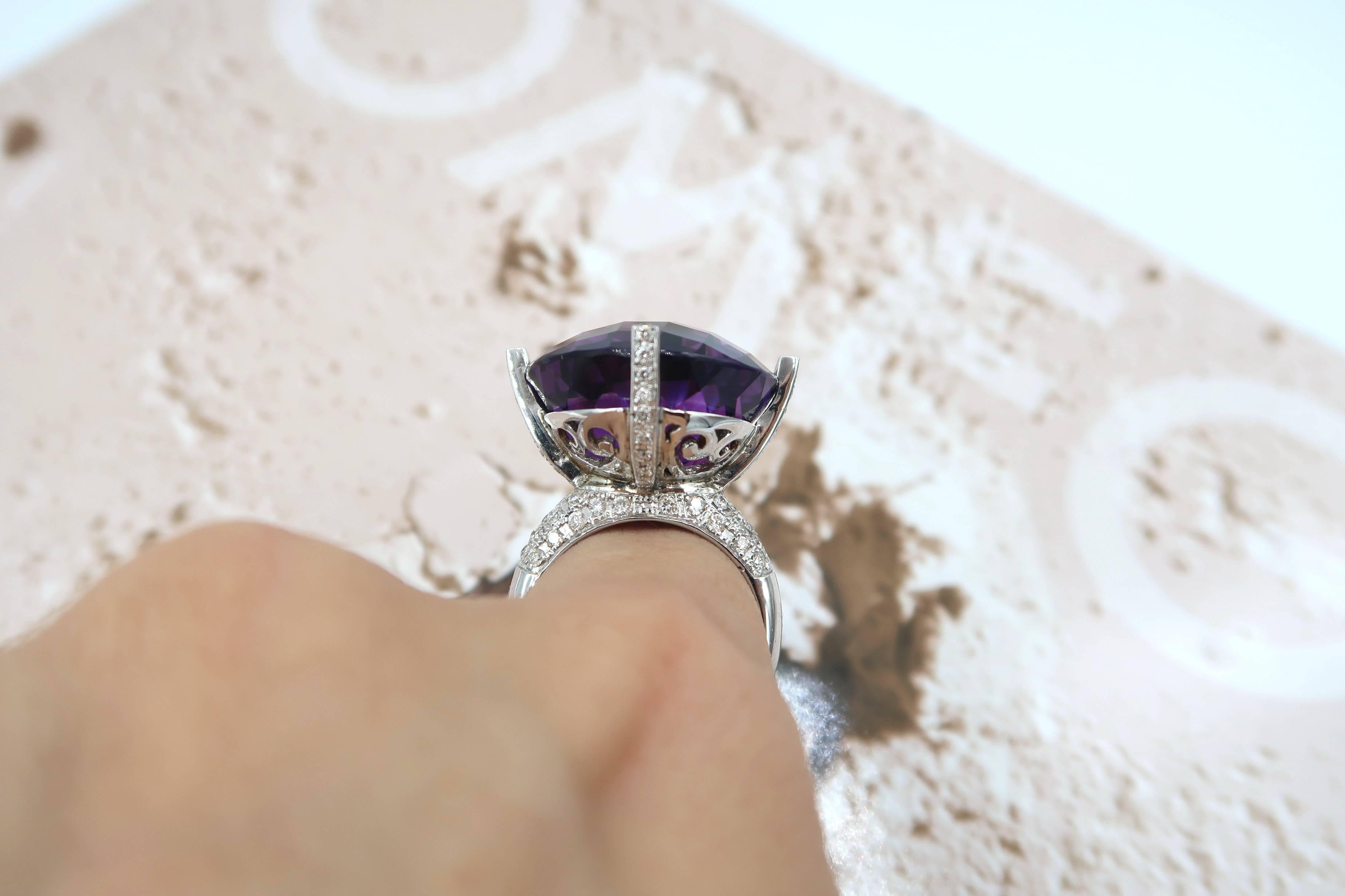 Large 26.84 Carat Intense Purple Amethyst Cocktail Ring with Diamond in 18K White Gold

A one-off complimentary resizing service is available for this ring. Please kindly contact us should you wish to have the ring resized.

Size : 53 / M / 6