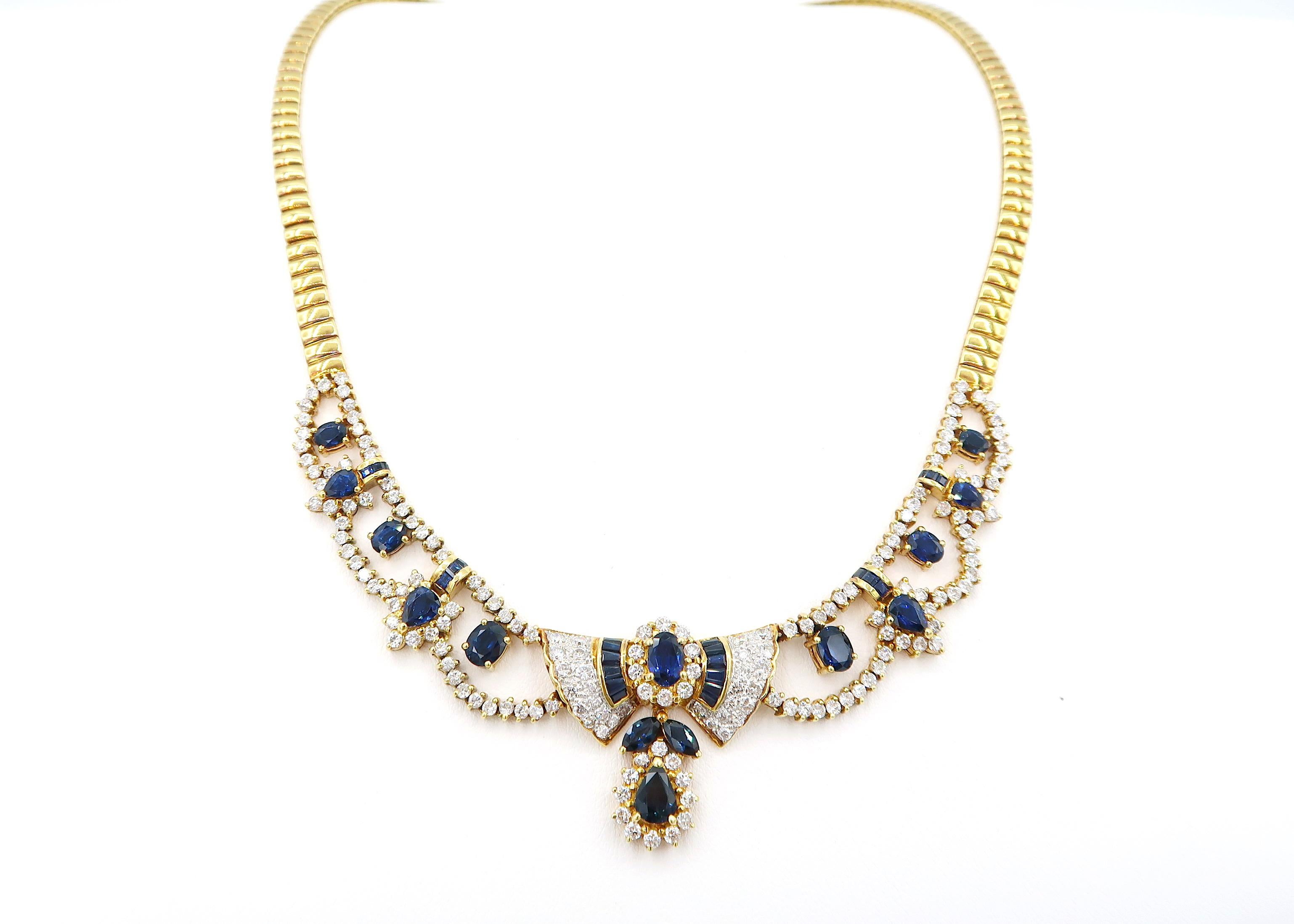 BOON Sapphire and Diamond Ribbon Detail Drop Scalloped Necklace in 18K Gold 

Diamond: 8.48cts.
Sapphire: 12.05cts.
Gold: 18K 46.787g.
