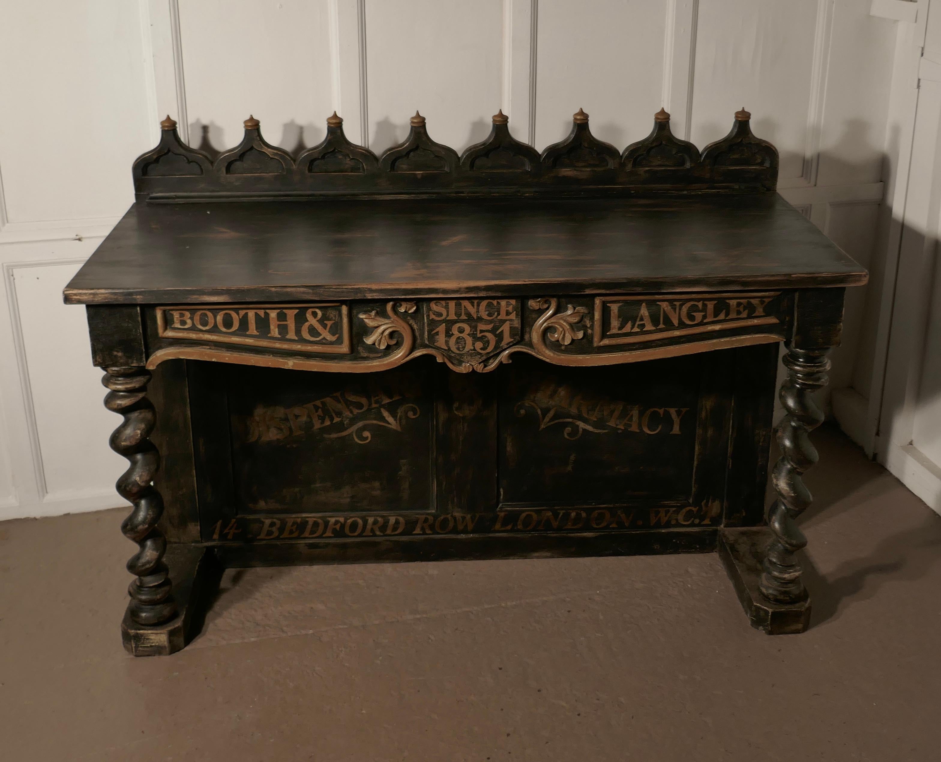 Booth and Langley Dispensing Pharmacy shop counter

This is a large black shop counter, it has a decorative back gallery with chunky barley twist turned columns to the front

The dresser is distressed but sturdy

It measures 60