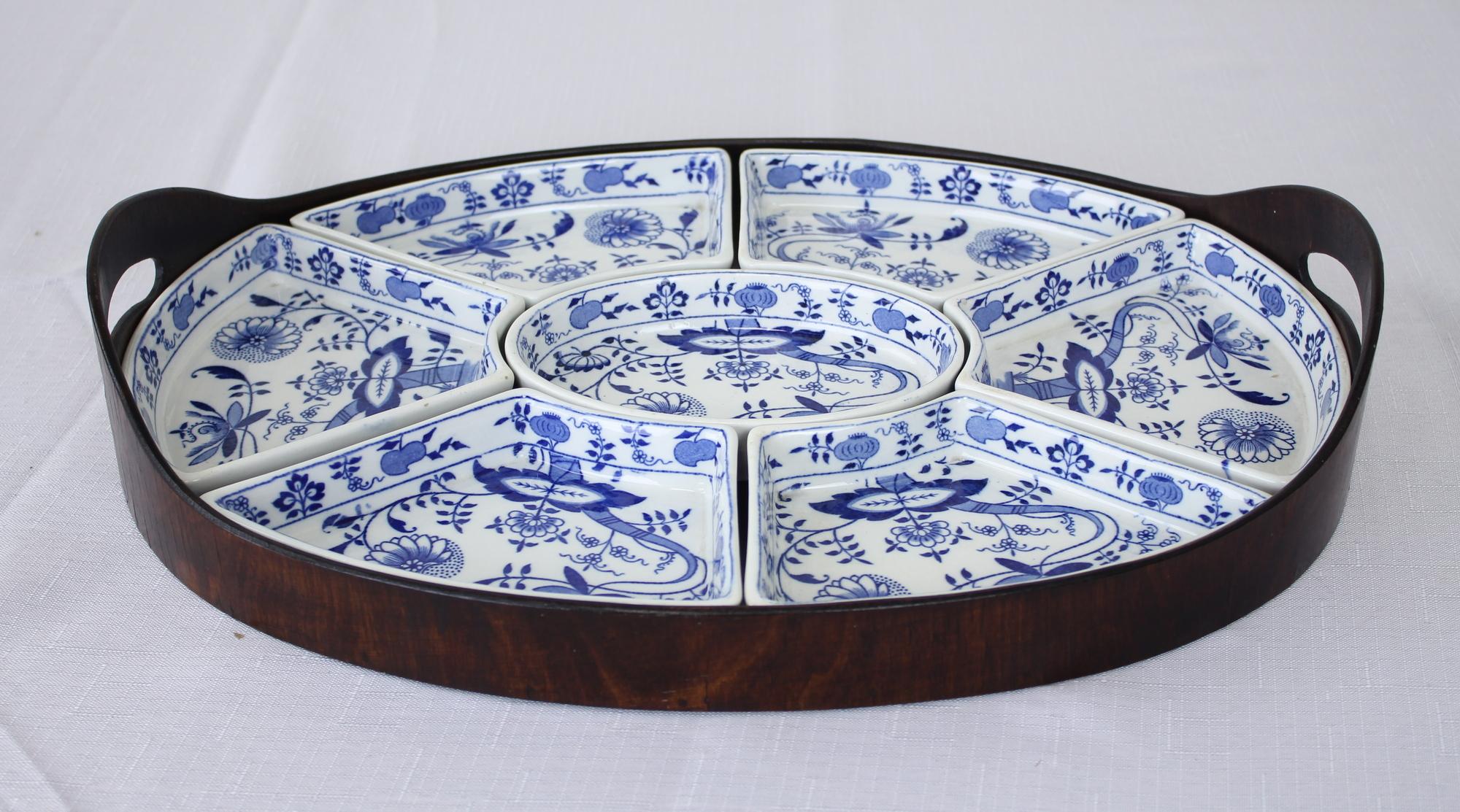 A seven piece hors d'oeuvres dishes and tray from the renowned English pottery company Booths in their 