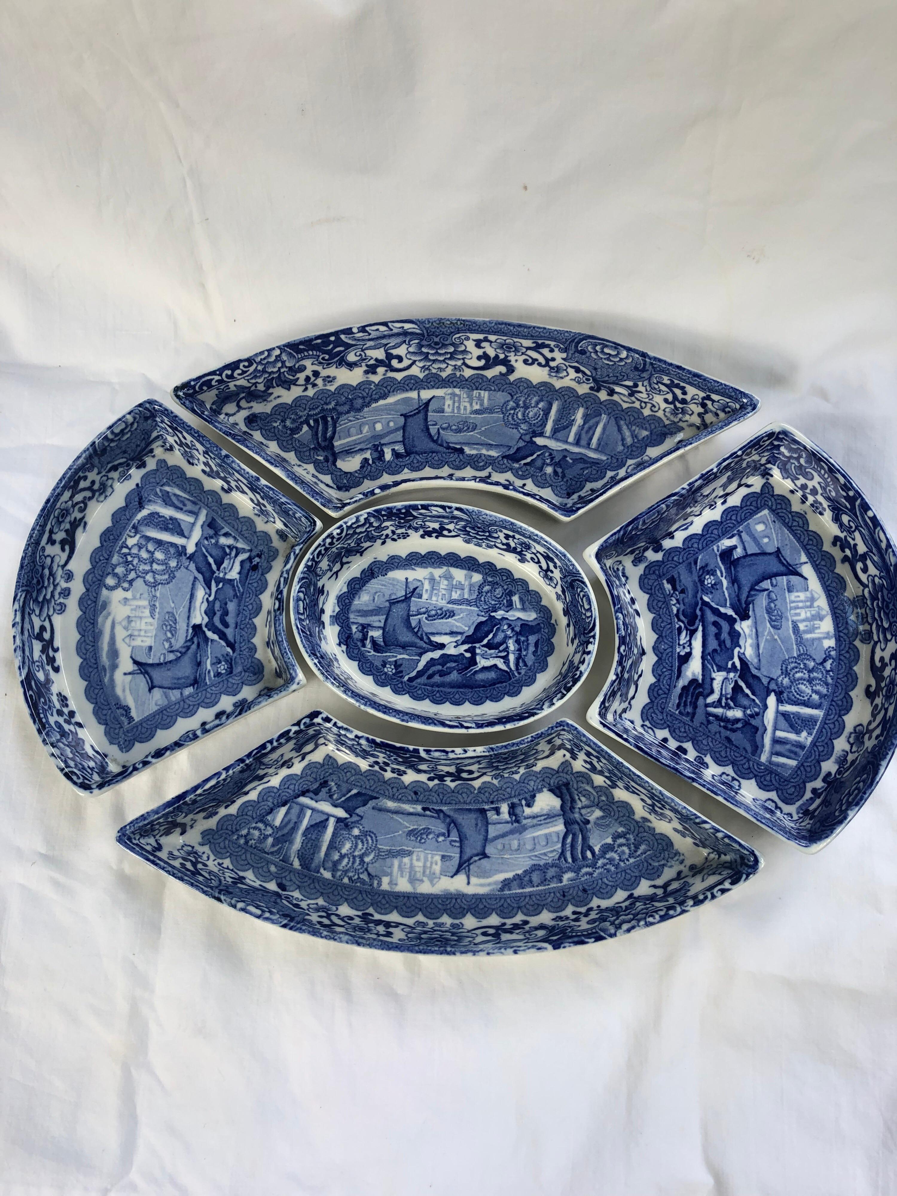 Booths transfer printed porcelain or sweet meats dishes in the old blue Danube pattern.
Comprising five dishes in a stained wood cradle/tray. 12.5