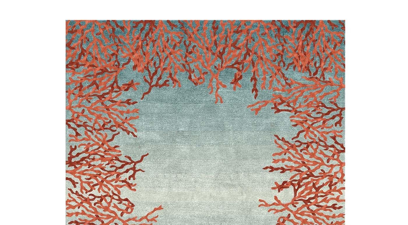 Inspired by the splendor of coral in the turquoise water of the Pacific Ocean, this sophisticated rug will add a colorful and textured accent to both a contemporary and a traditional interior. This unique piece is hand knotted by expert artisans in