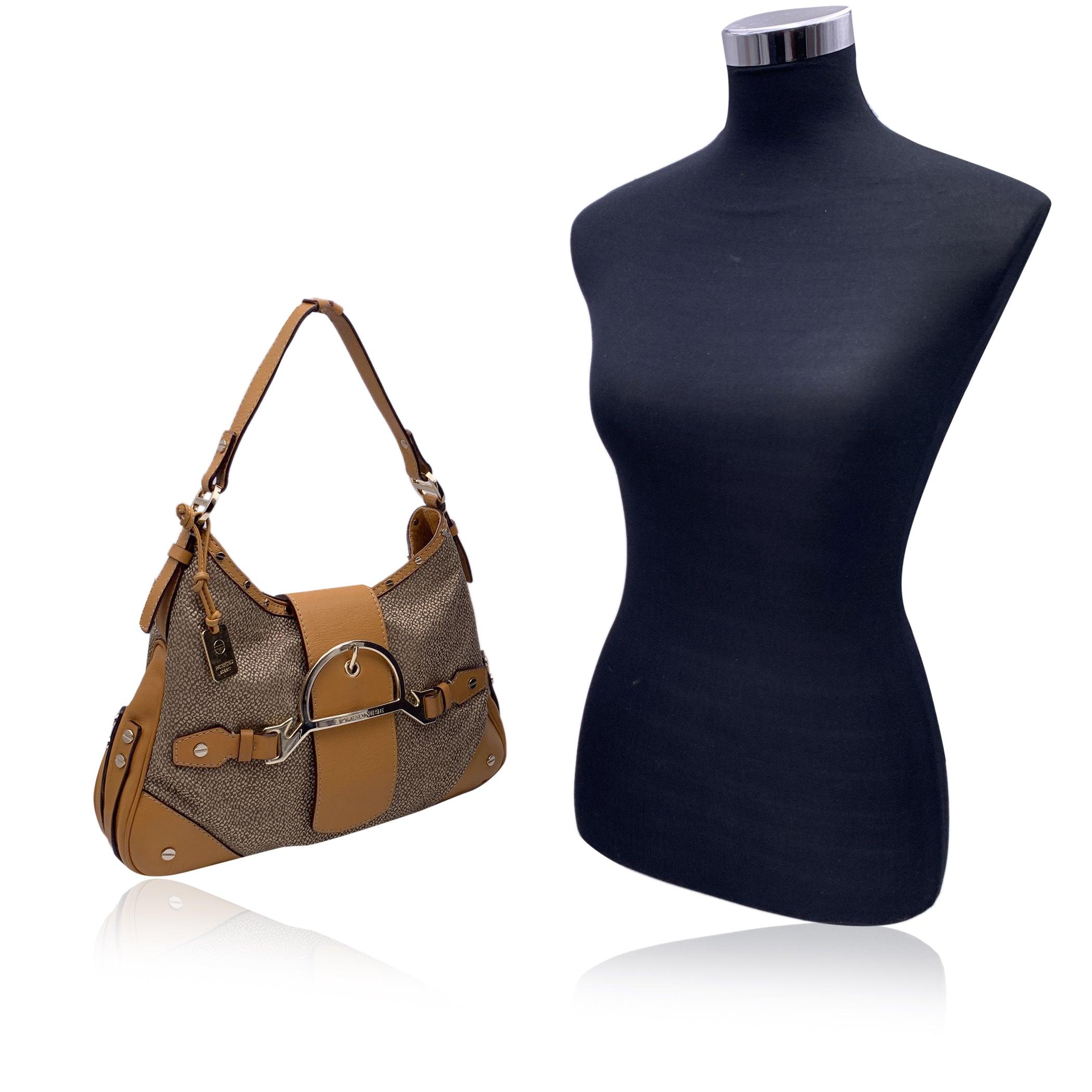 Borbonese beige OP canvas with beige leather lining hobo bag. Gold metal hardware. Fold over strap with magnetic button closure. Black fabric lining. 1 side zip pocket inside. Borbonese tag inside. Condition B - VERY GOOD Gently used. Some wear of