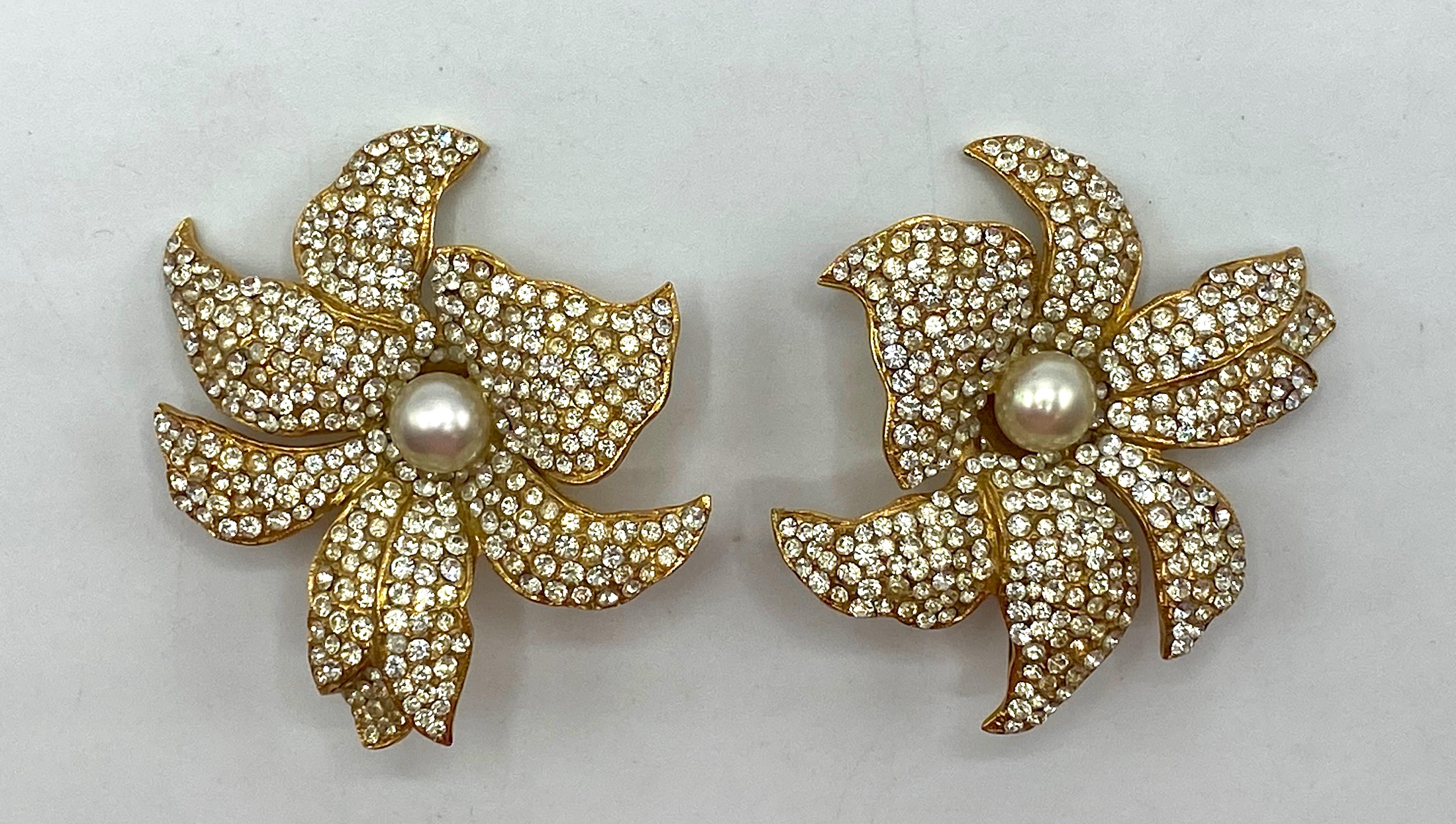 From the venerable fashion house, Borbonese, presented is this beautiful pair large flower earrings from the 1980s. The earrings are fashioned with a right and a left earring to compliment each other and intentionally not be identical when worn. The