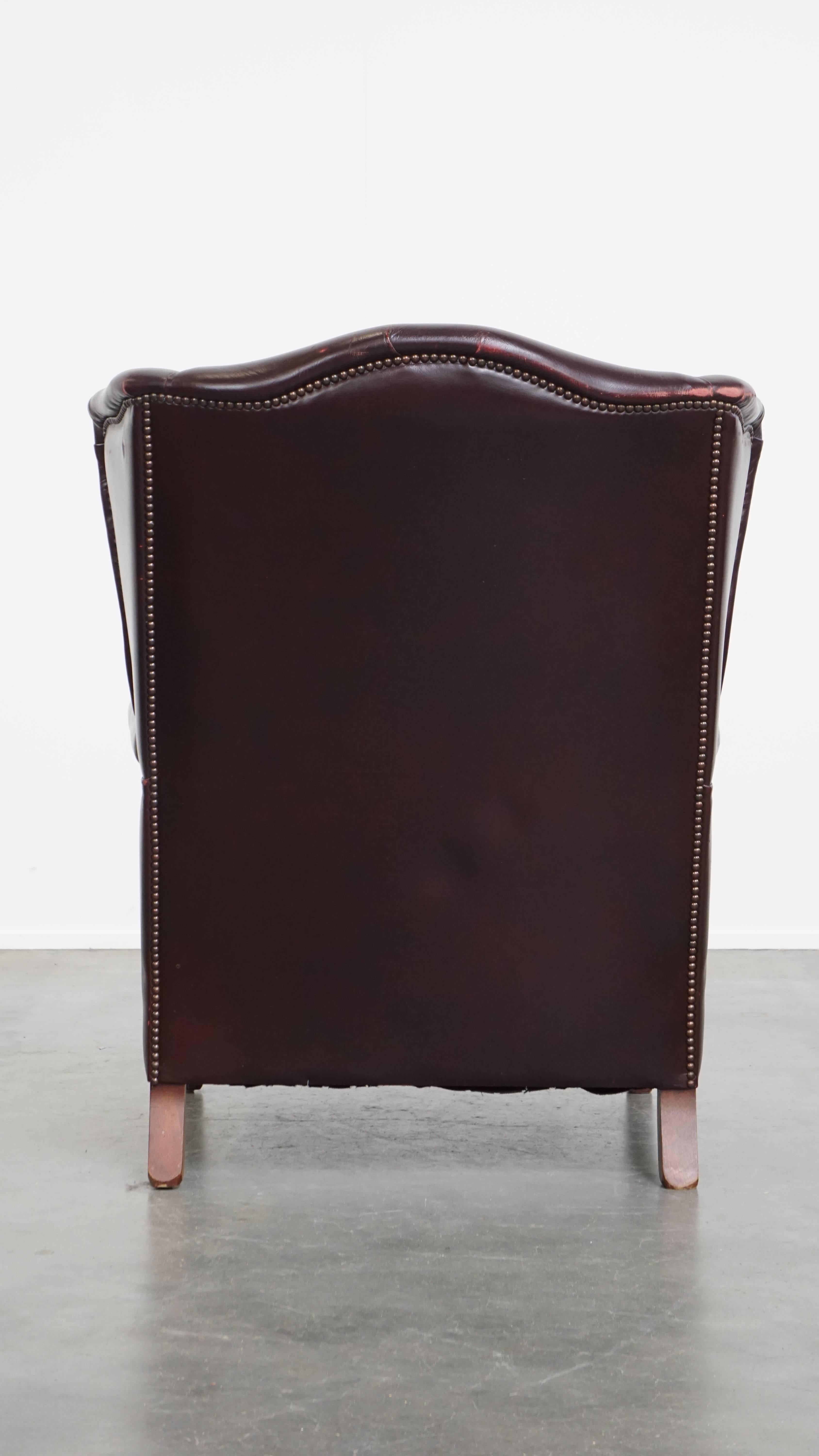 Hand-Crafted Bordeaux Red Cowhide Wingback Armchair + Ottoman in English Style For Sale