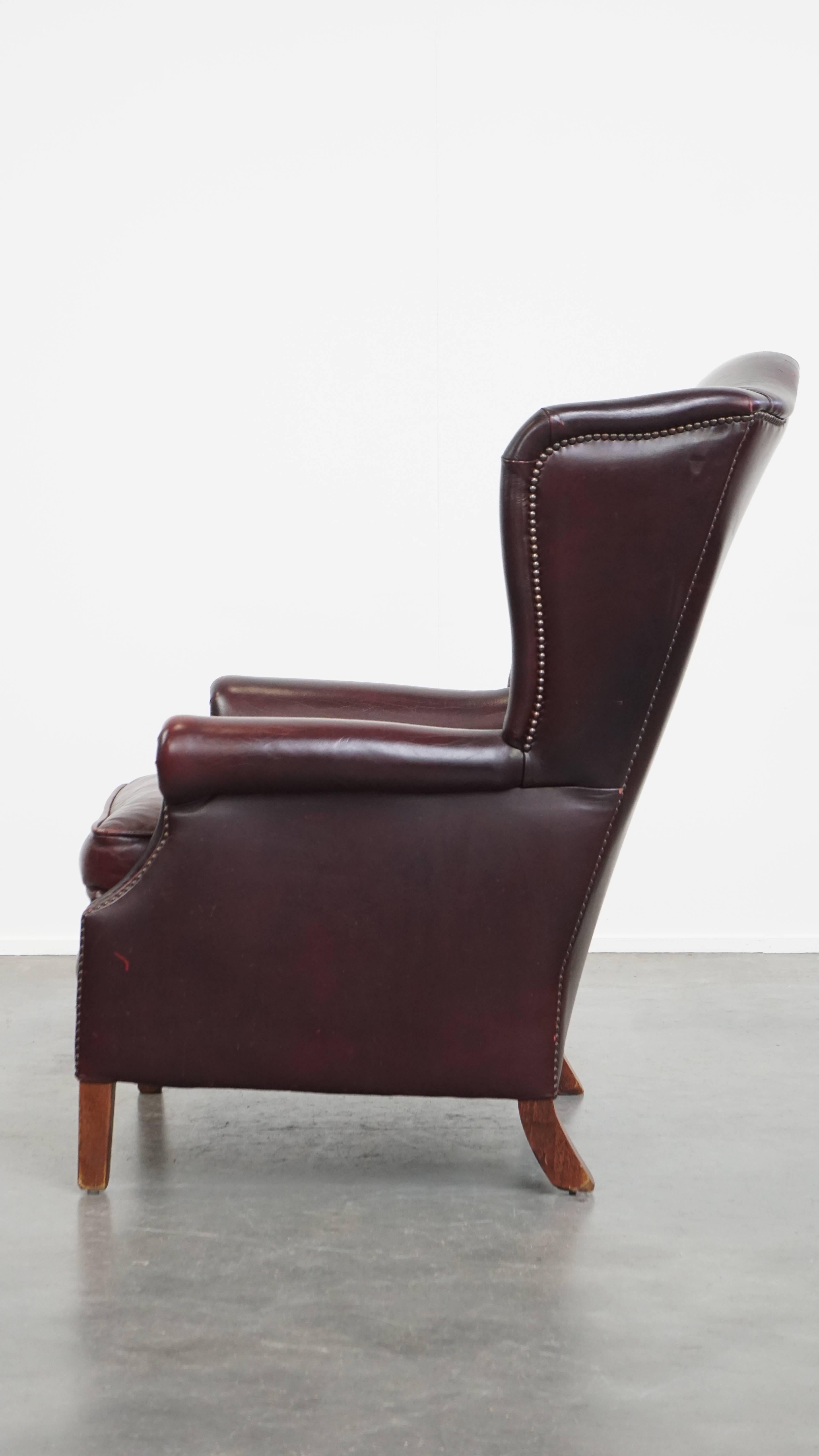 Bordeaux Red Cowhide Wingback Armchair + Ottoman in English Style In Good Condition For Sale In Harderwijk, NL