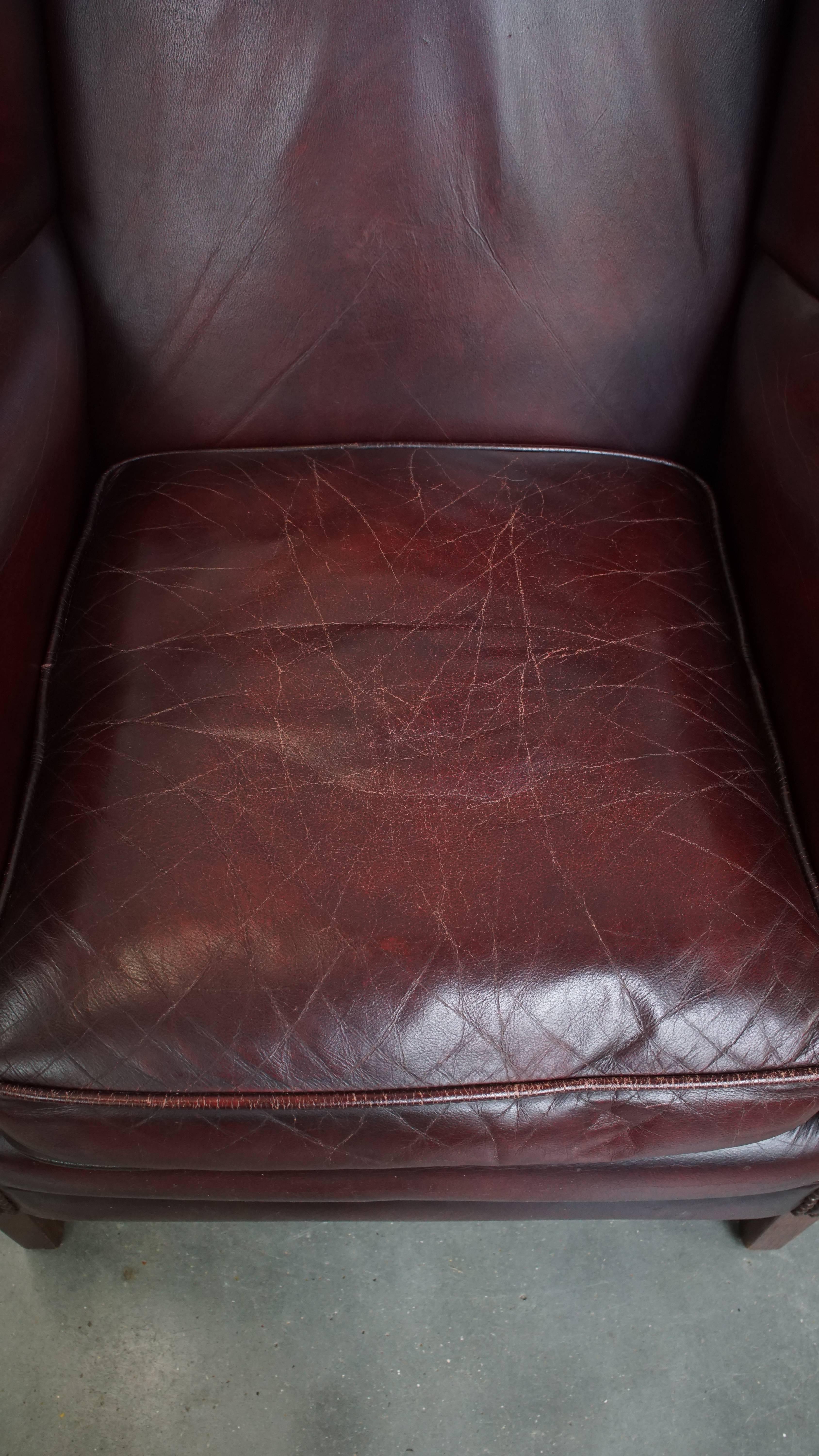 Contemporary Bordeaux Red Cowhide Wingback Armchair + Ottoman in English Style For Sale