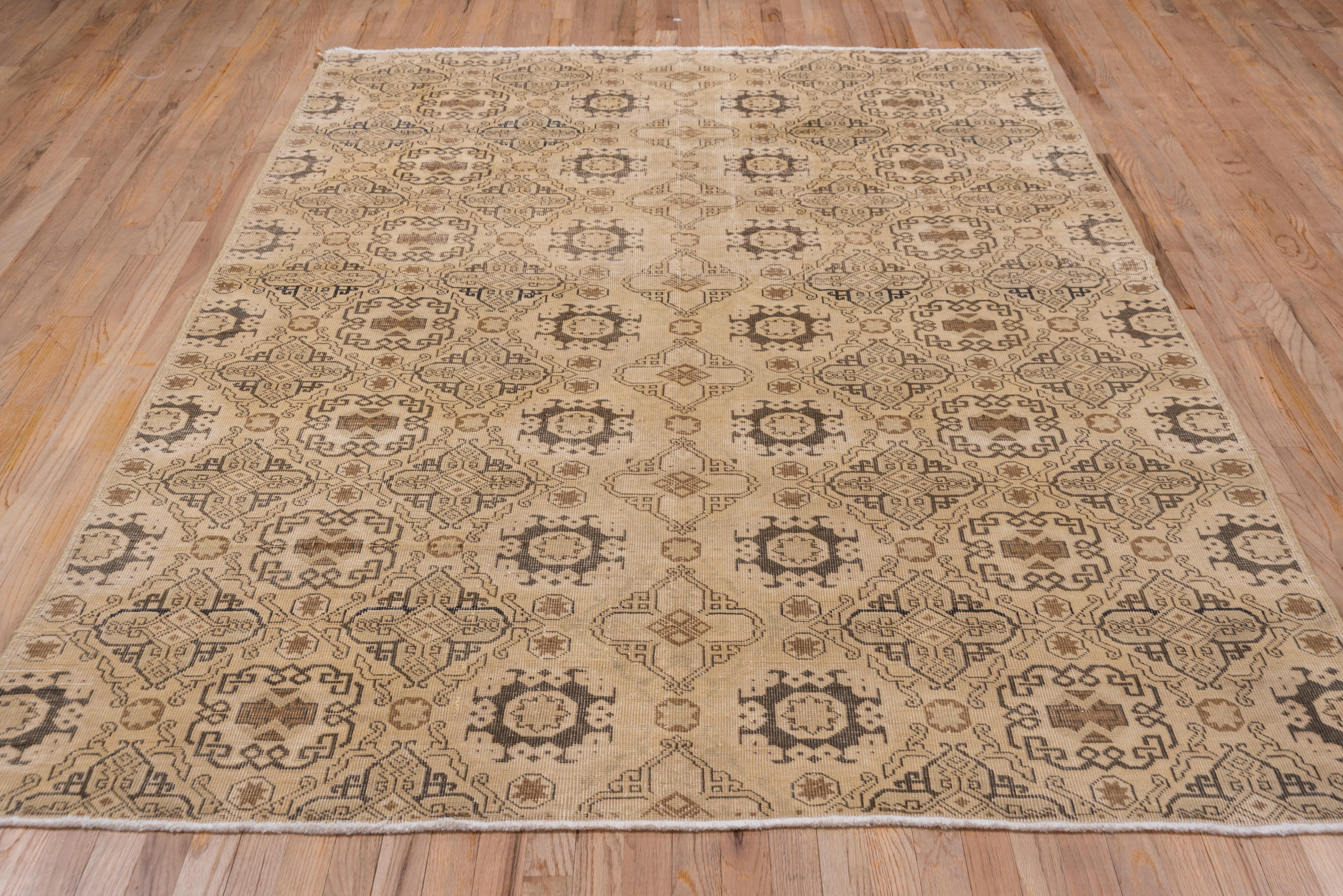 The buff-beige field of this west Anatolian large rug display a 15th century 