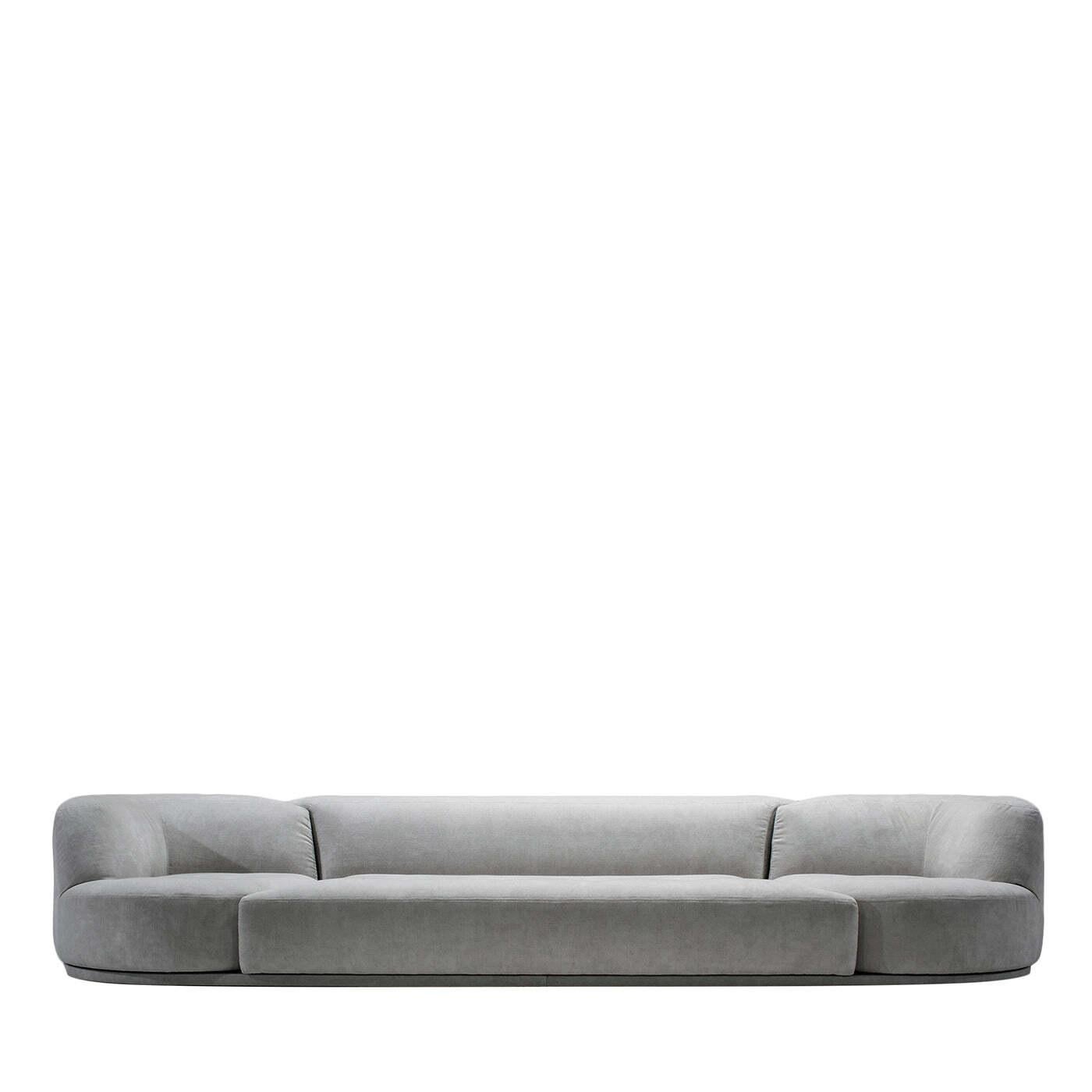 A captivating blend of minimalist design and iconic style, this sofa will guarantee utmost comfort and relaxation. Multifunctional, original and sophisticated, it features a welcoming modular shape comprised of three elements with a curved backrest.