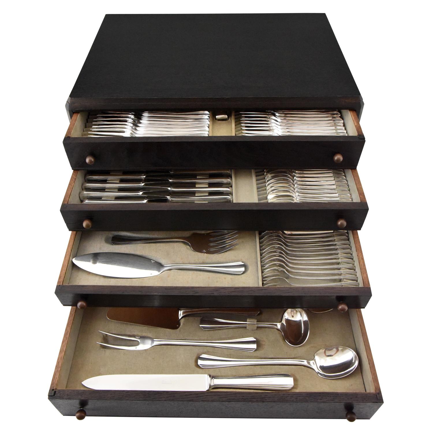 Boreal extensive Art Deco silver plated flatware set for 12 people.
Designed by Luc Lanel for Christofle in 1929.
144 pieces.
11 x 12 = 132
12 serving utensils
The set is contained in the original wooden chest of 4 drawers.
Christofle