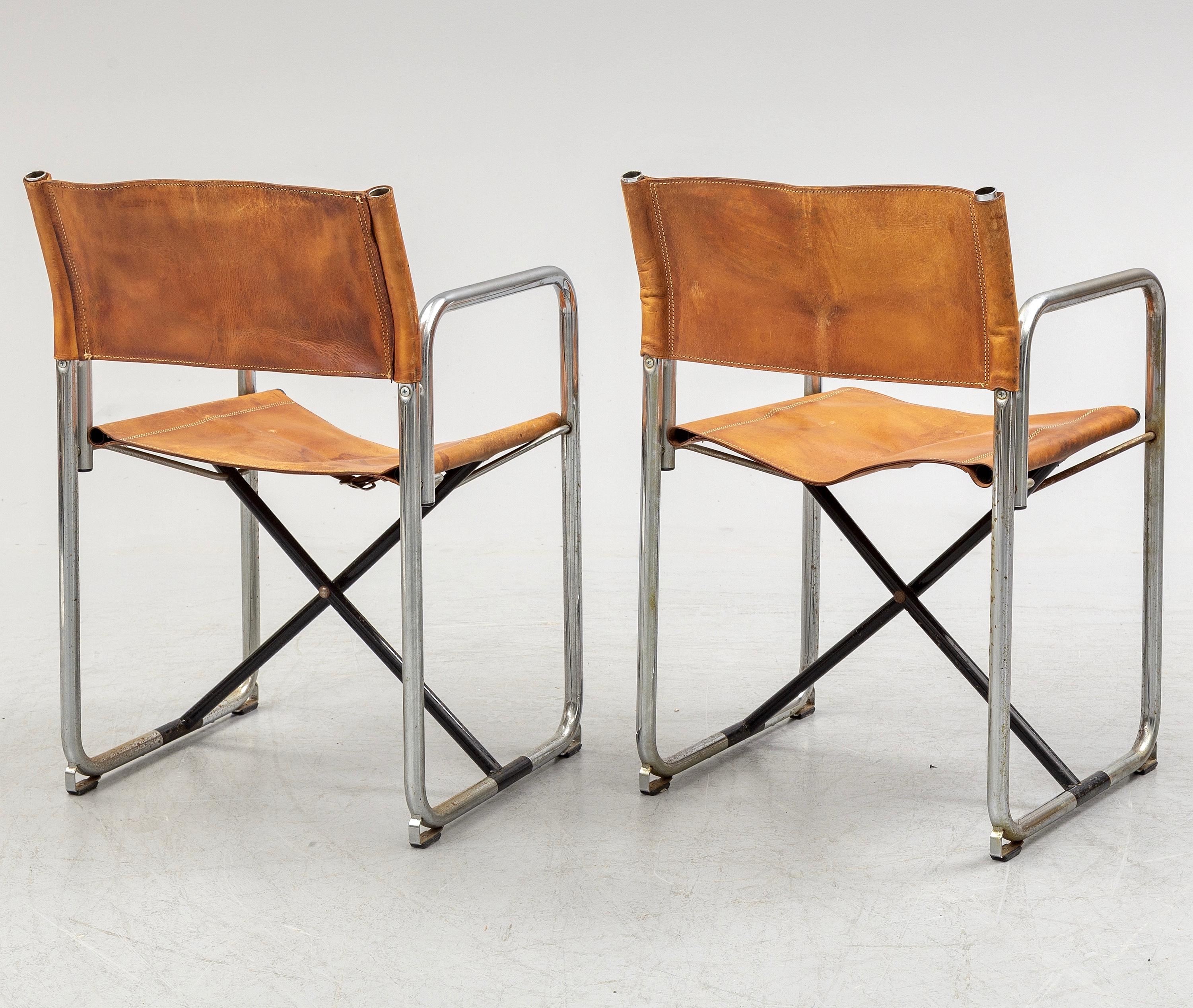 Early set of two folding chairs in chromed steel and original vegetal tanned leather, designed by Borge Lindau & Bo Lindekrantz and produced from the 60s by Swedish Lammhults.