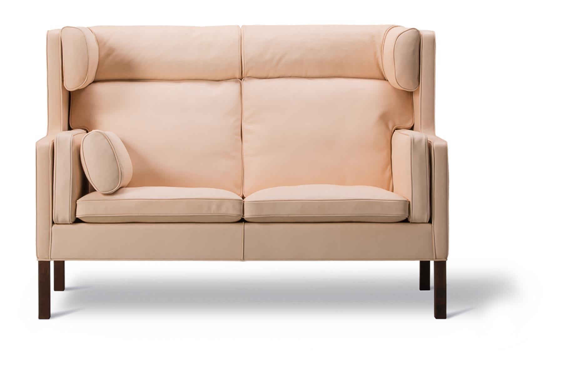 Designed in 1971, the Coupé sofa has a high enveloping back with wings, providing a calm retreat in larger spaces or a cosy setting in front of a fireplace.

Available leg finishes: lacquered oak or walnut, oiled oak, soaped oak.

 

  