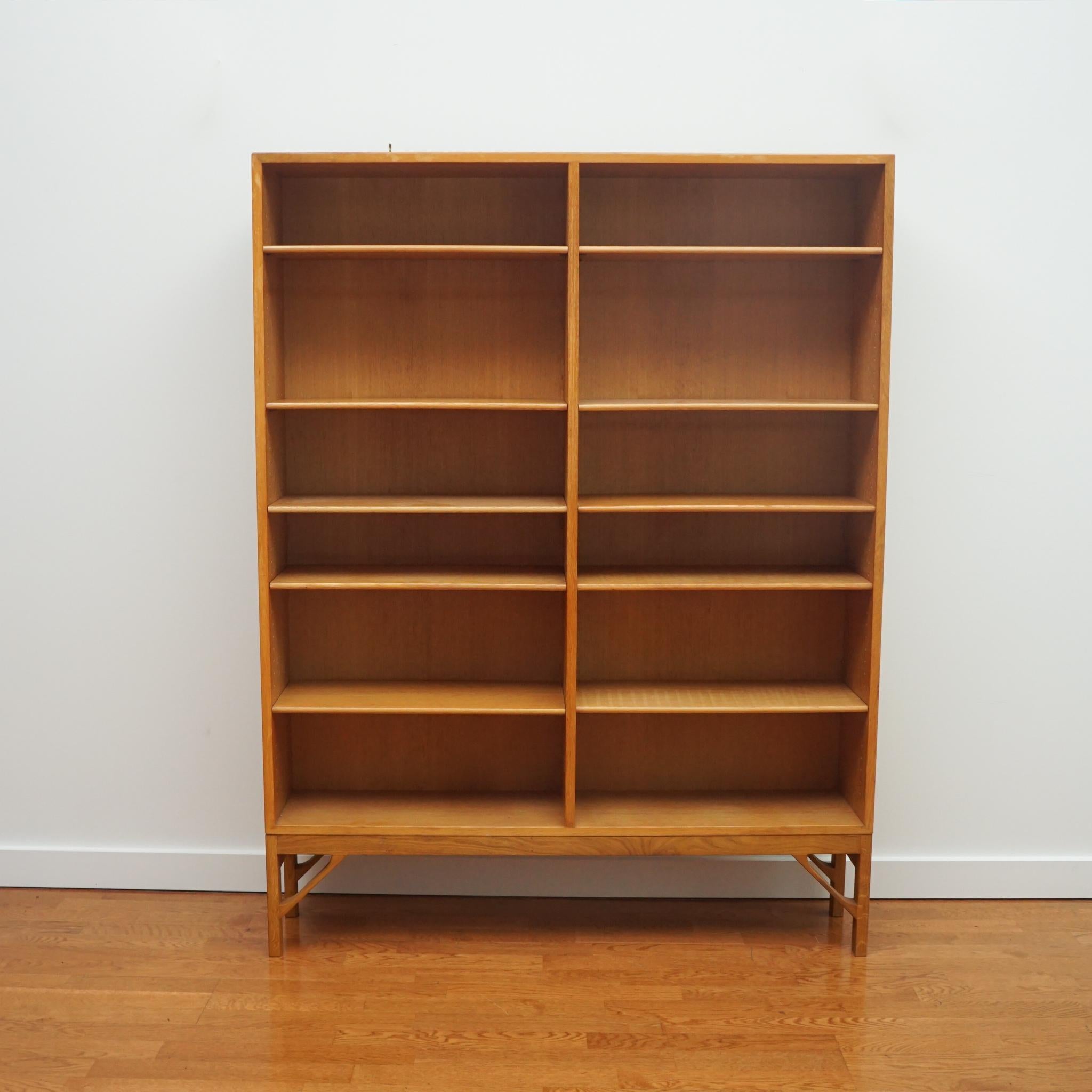 The Borge Morgensen oak bookcase, shown here, is only one of a set of three available. Featuring adjustable shelves, the bookcases reflect the clean lines and classic style for which the designer is known. Bookcases are partially stamped with