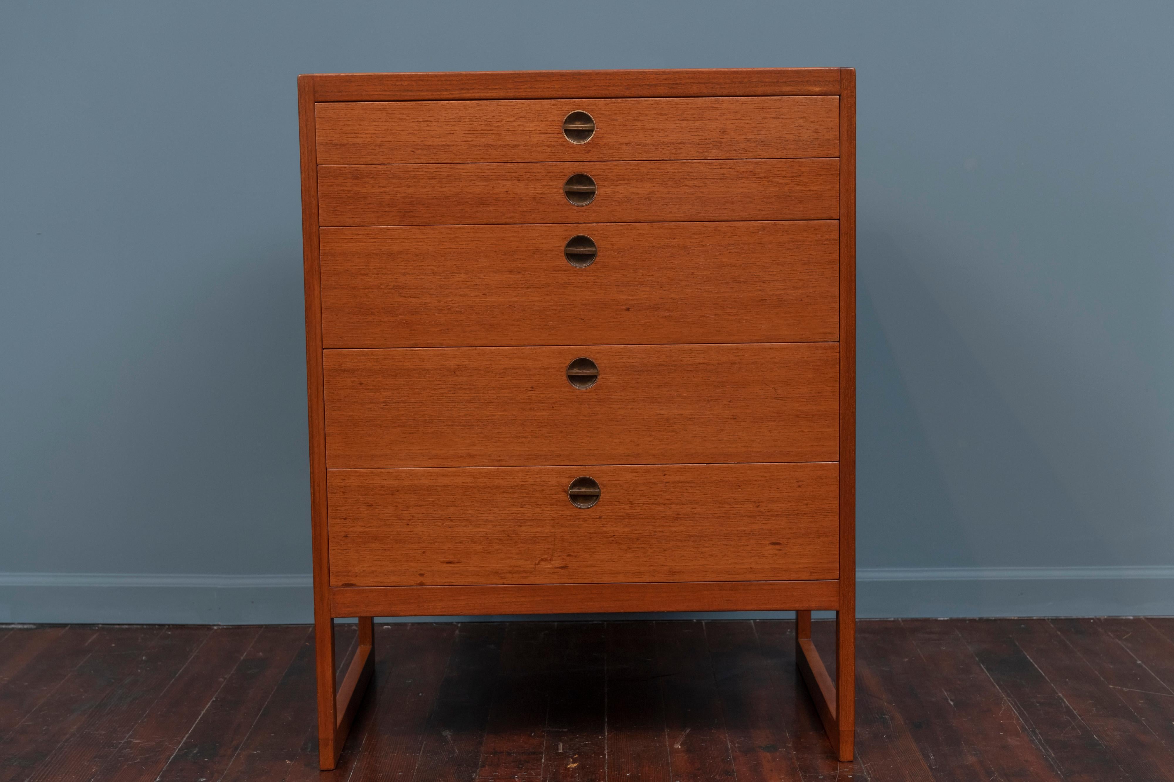 Borge Mogensen design teak and oak chest of drawers for P. Lauritsen and Son, Denmark.
 High quality design and construction featuring 5 drawers with inset solid brass pulls and newly refinished.