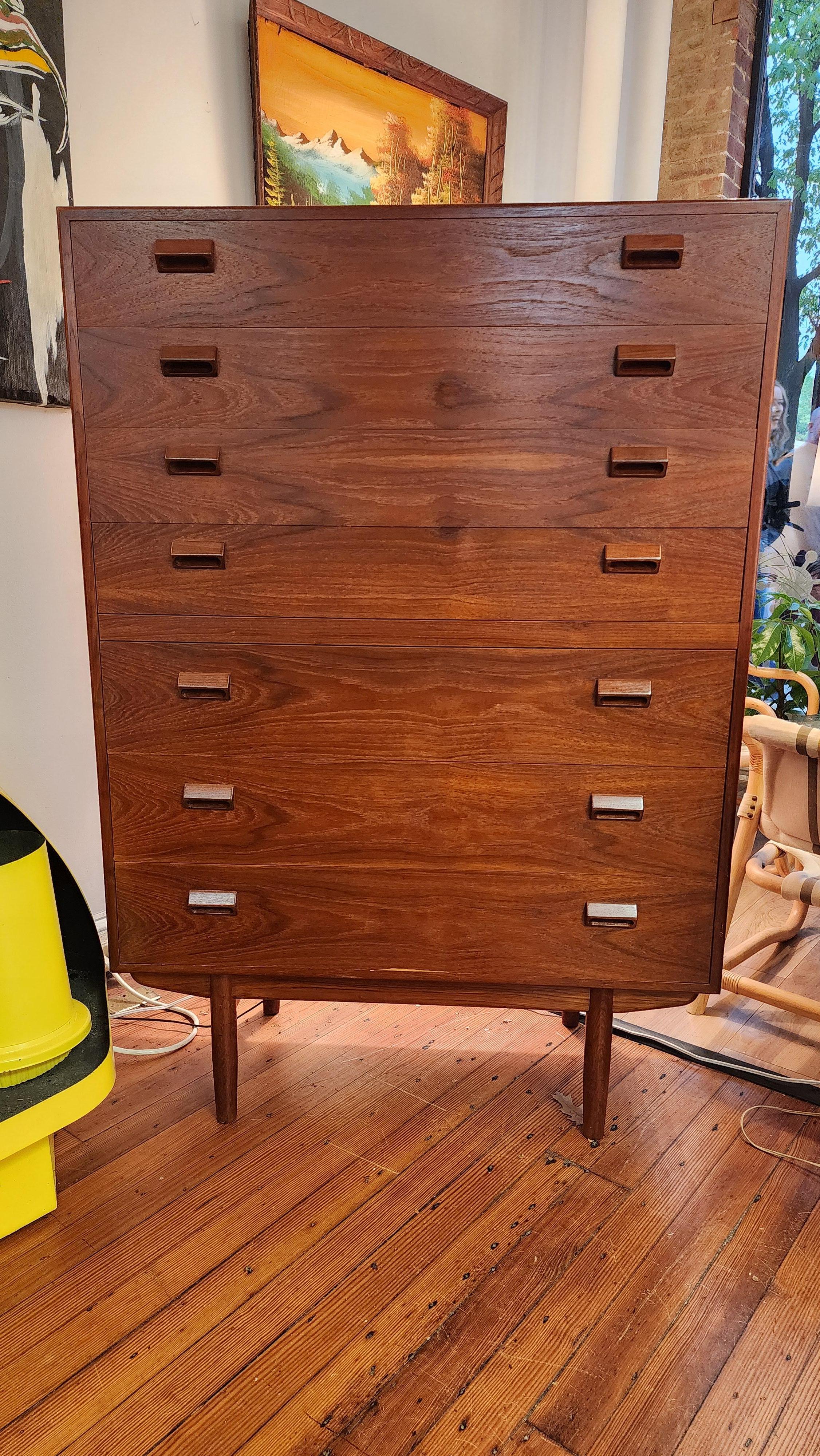 This massive Danish teak tall chest was designed by Borge Mogensen, one of the most important designers in Danish Modern furniture. This dresser was owned by the same family, who purchased it be in the 1960s, until it was entrusted with us. 
It or