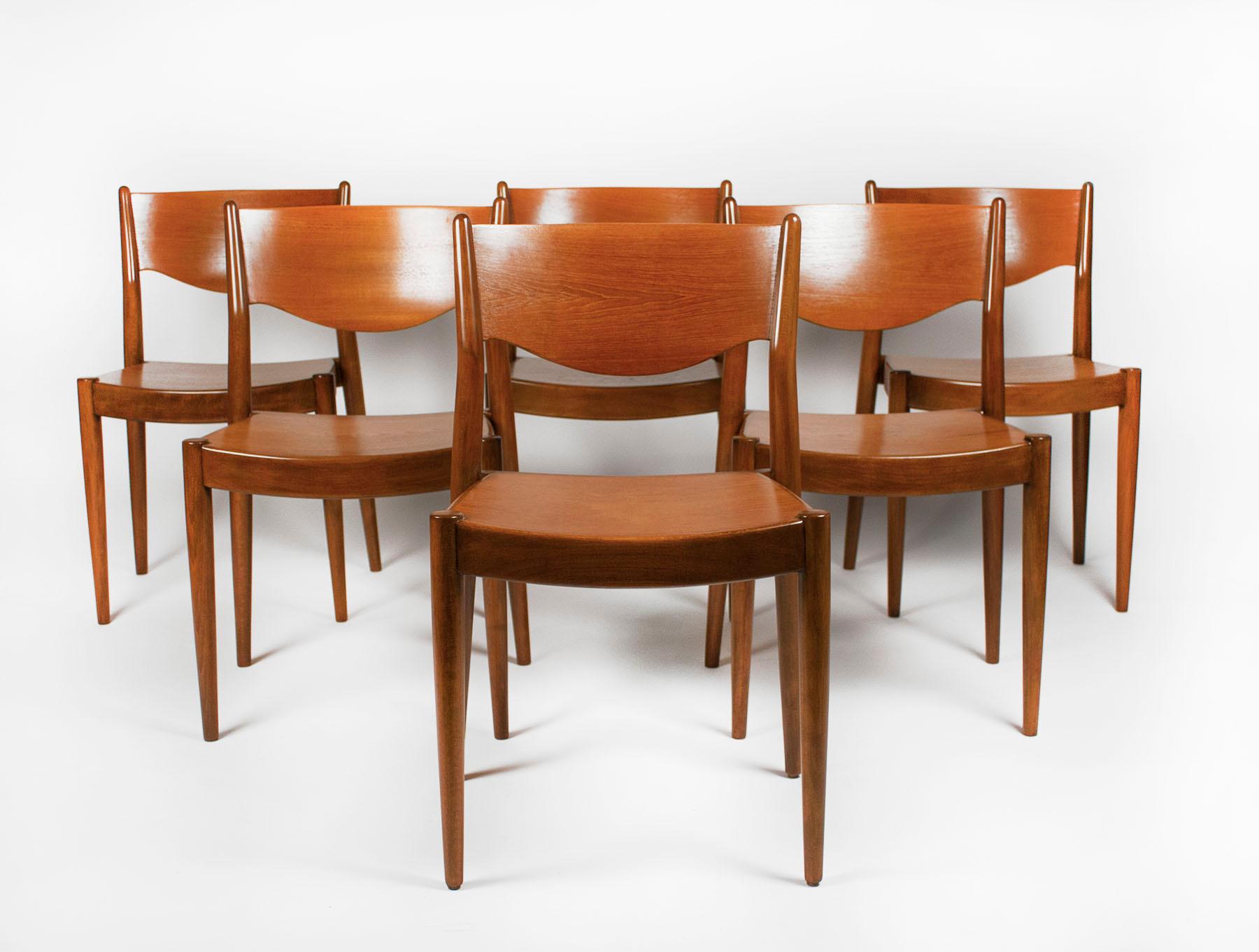 Set of ten dining chairs with teak seats and backs with beechwood frames designed by Borge Mogensen and produced by C.M. Madsens of Denmark. 
 