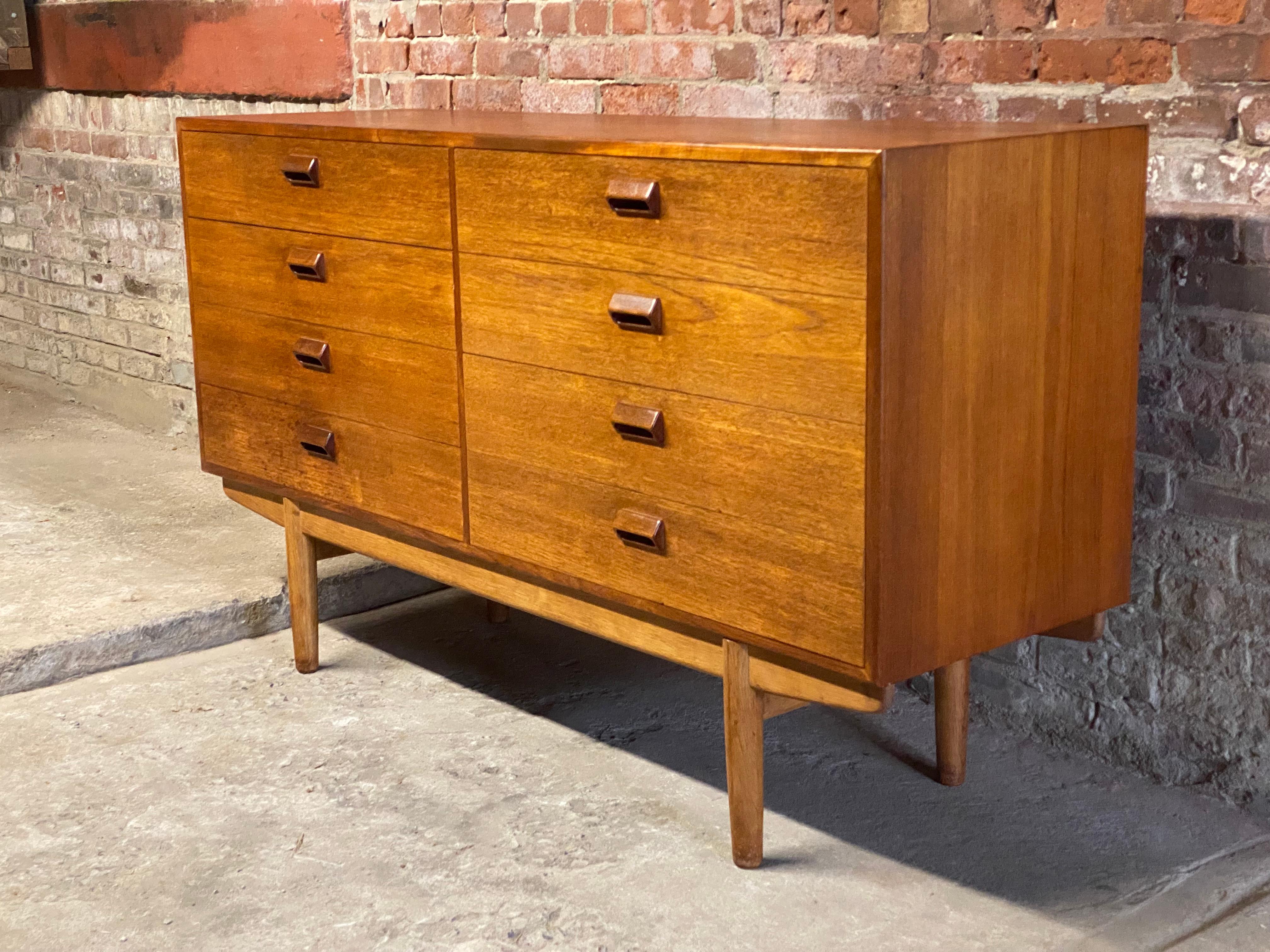 Borge Mogensen for Soborg Mobler teak and oak eight drawer dresser. Teak cabinet with a solid oak base. Circa 1960. Signed on back. Good overall condition with minor wear from age and use. Structurally sound and sturdy construction. No visible