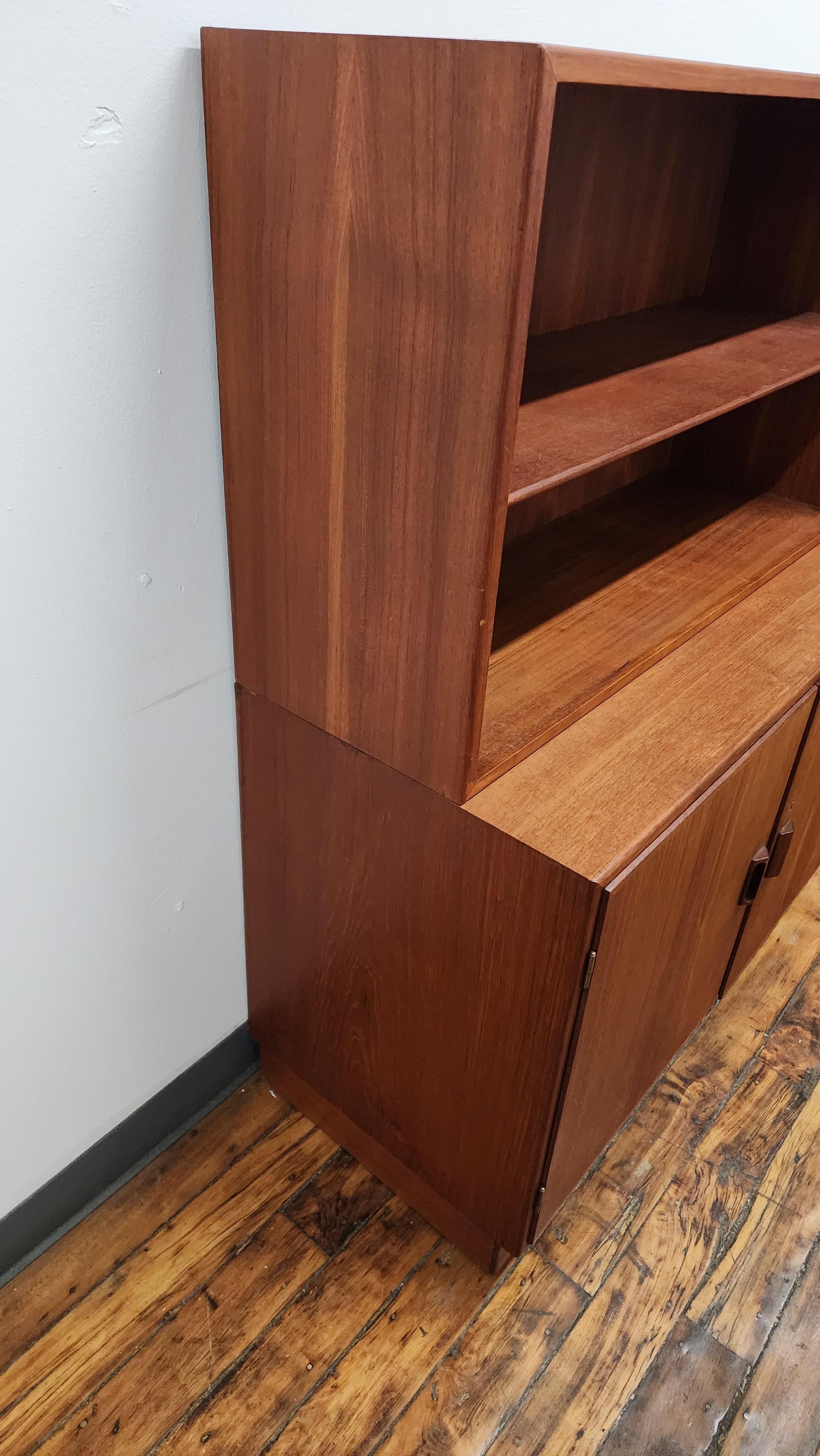 Borge Mogensen for soberg teak cabinet and bookshelf.  the cabinet doors open to a shelf inside. the bookshelf on top is removable and has an adjustable shelf.  no key is present.