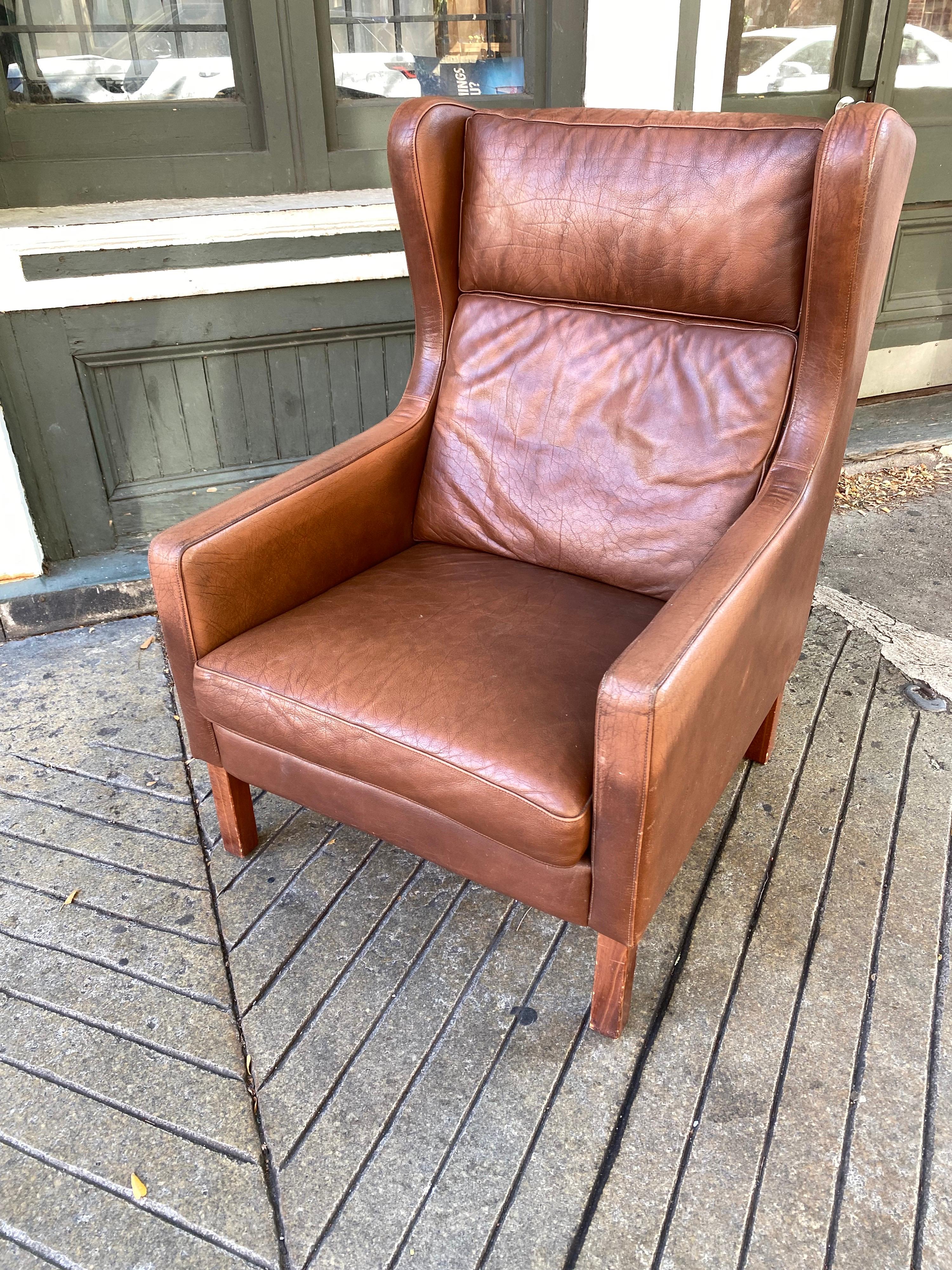 Borge Mogensen leather wing chair. Nice Brown leather showing great Patina. No rips or tears, just wear you would expect from use. Very comfortable and nice size!