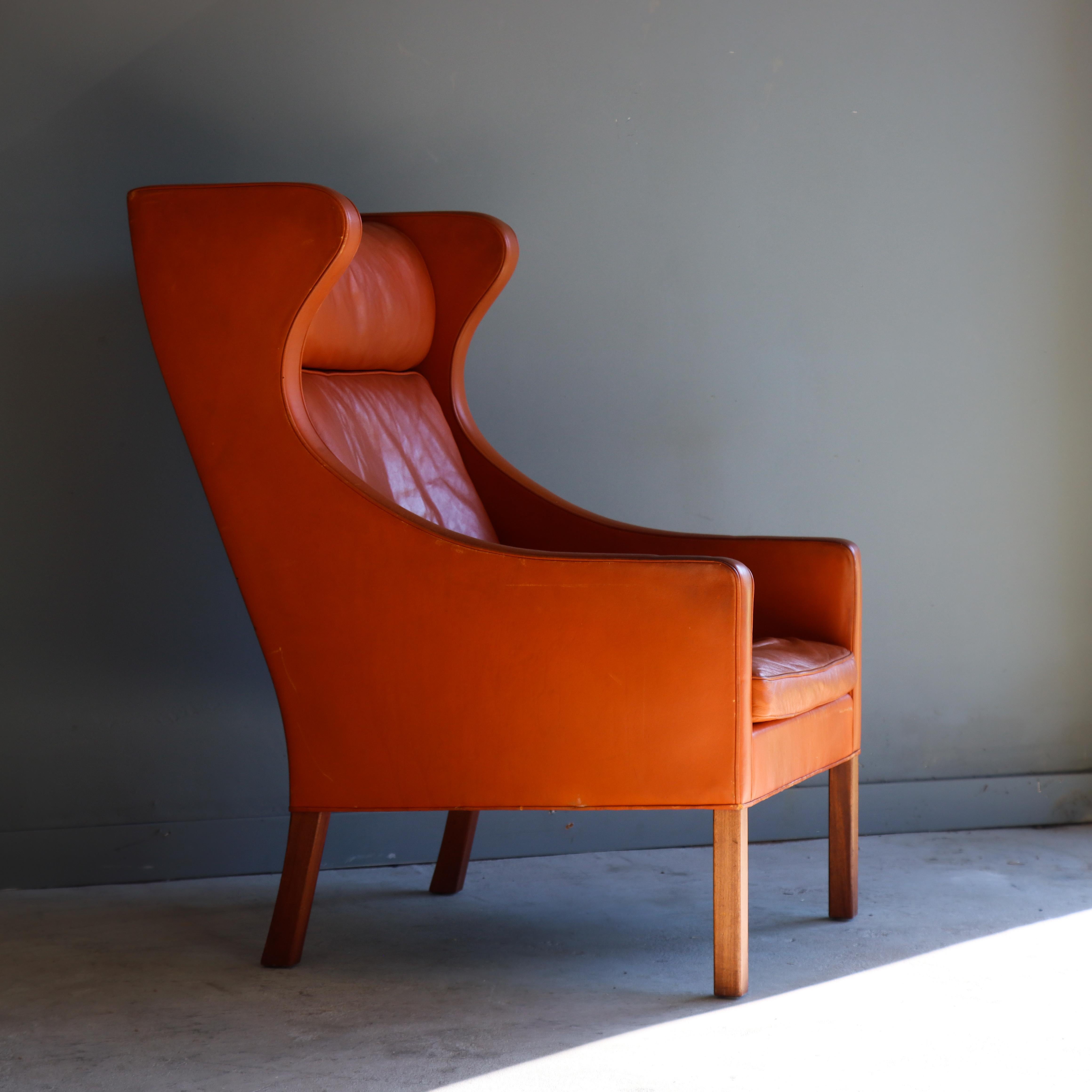 Highback wingchair designed by Borge Mogensen, and manufactured by Fredericia in Denmark, circa 1960.

TOne of Mogensen’s most notable designs, its high quality original leather and sharp lines make this a classic that blends with just about any