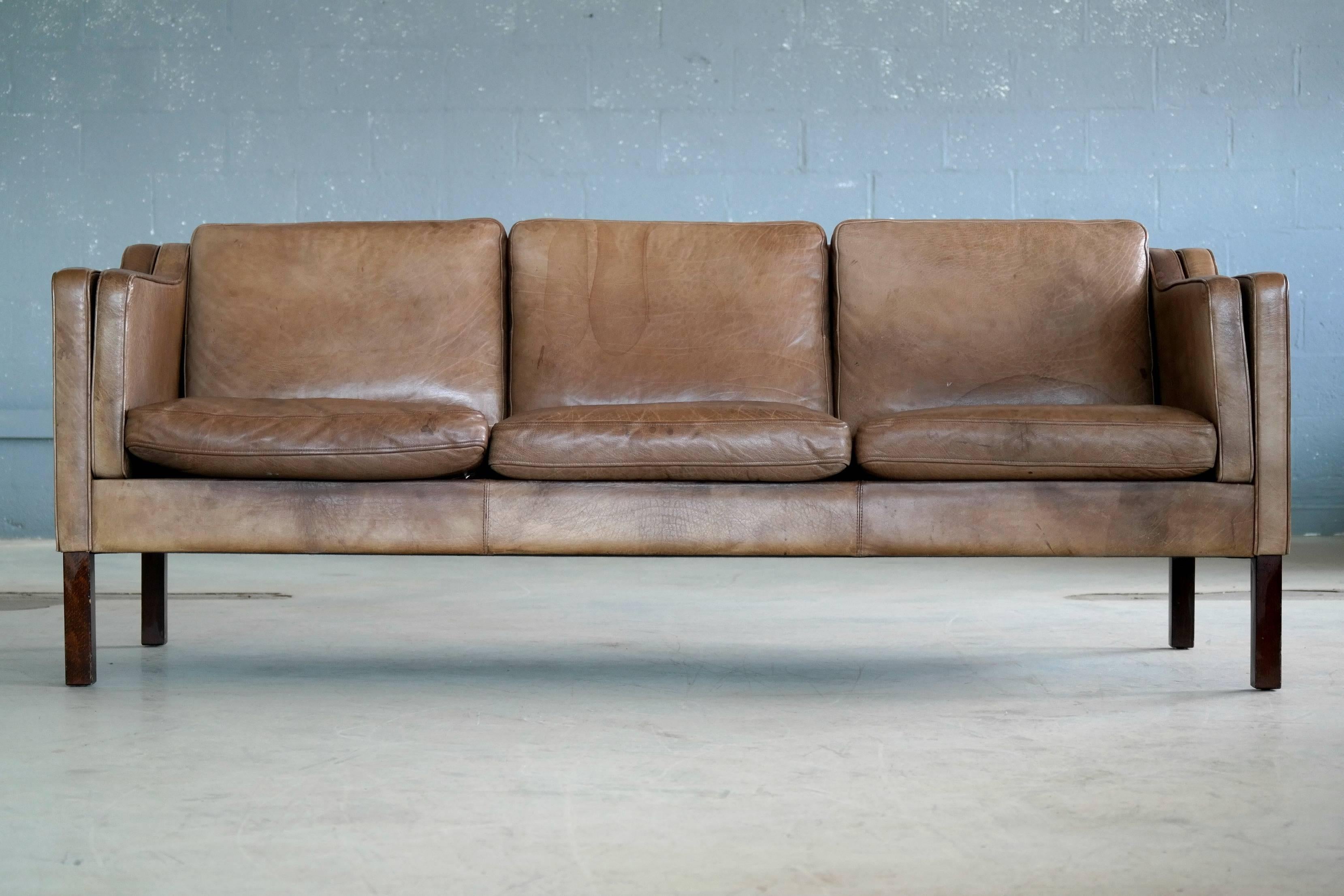 Classic Børge Mogensen style sofa model 2213 designed by Georg Thams in the late 1960s and manufactured by Vejen Polstermobelfabrik in Denmark, circa 1970. High quality buffalo leather displays the natural skin characteristics you would expect to