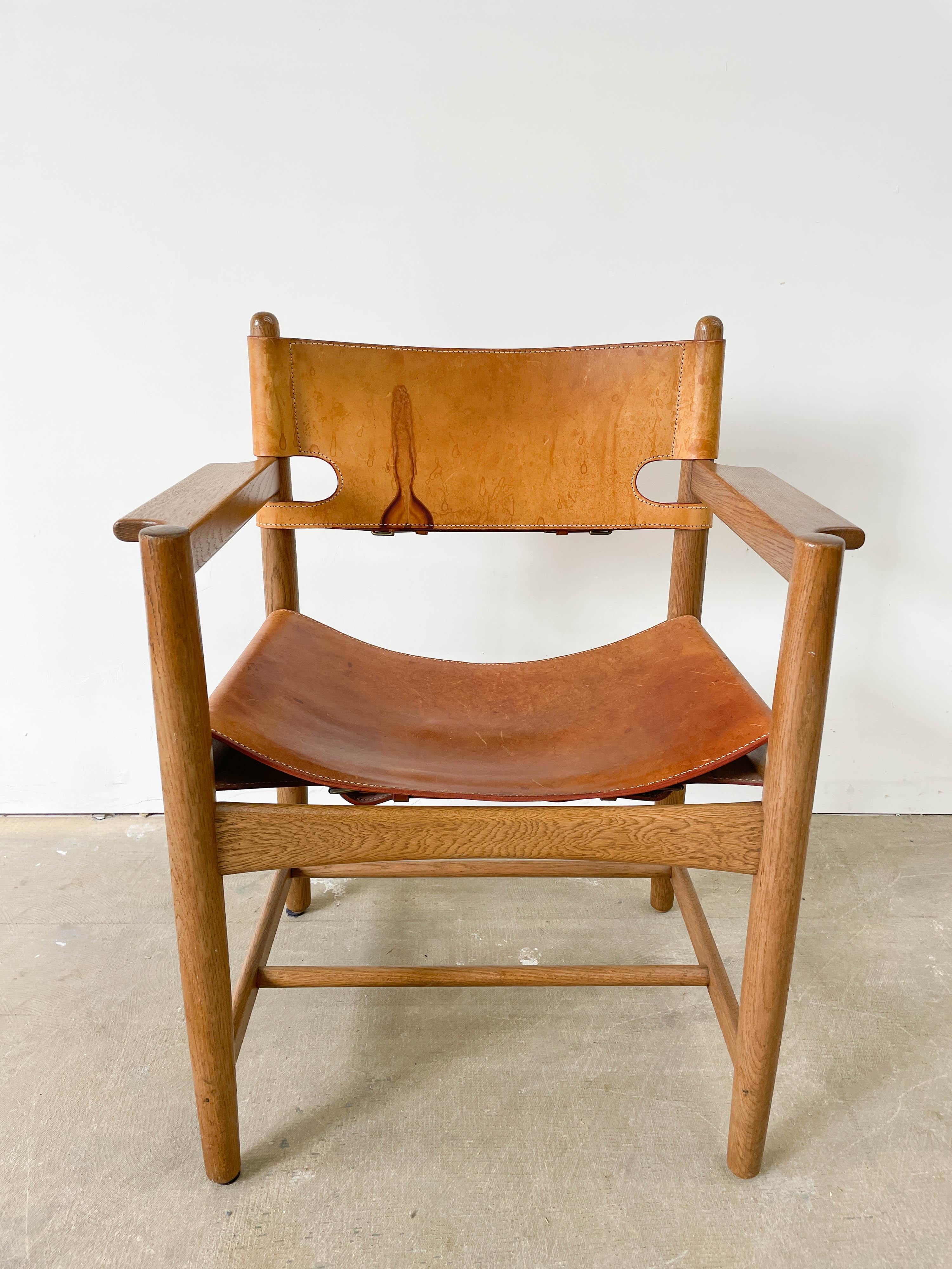 Wonderfully patinated Oak and Leather armchair by Borge Mogensen for Frederica in the 1960s. Mogensen's signature restrained and honest frame design combines with thick leather slings and stylish buckles. Chair is very solid and leather holds the