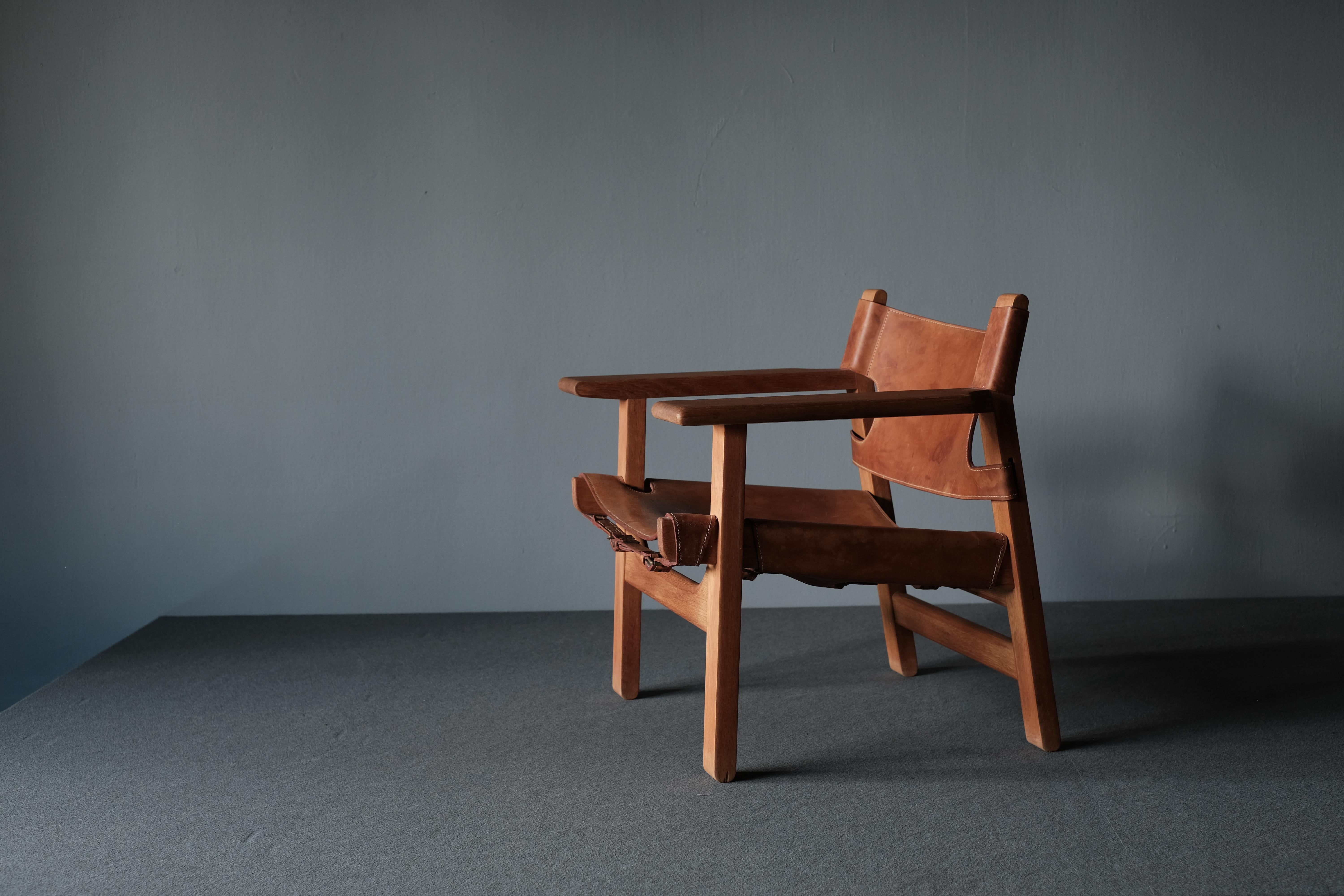 Spanish chair designed by Borge Mogensen in 1958 and produced by Fredericia. The chair’s gorgeously aged oak frames boast a lovely patina and finish. The hand stitching compliments the original high quality saddle leather which has taken on the