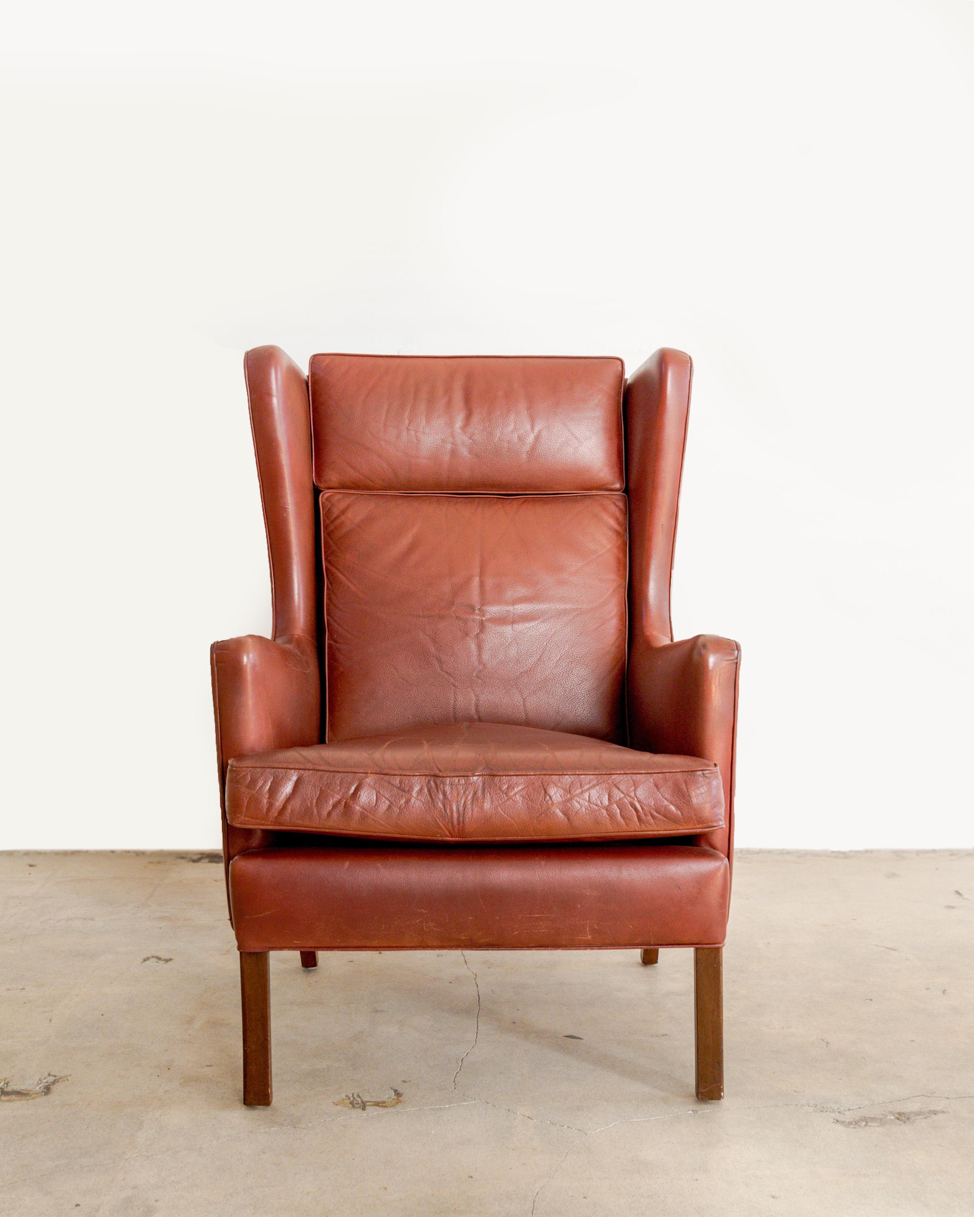Borge Mogensen wing chair in original oxblood leather with new cushion inserts, Denmark, circa 1960.’s.
