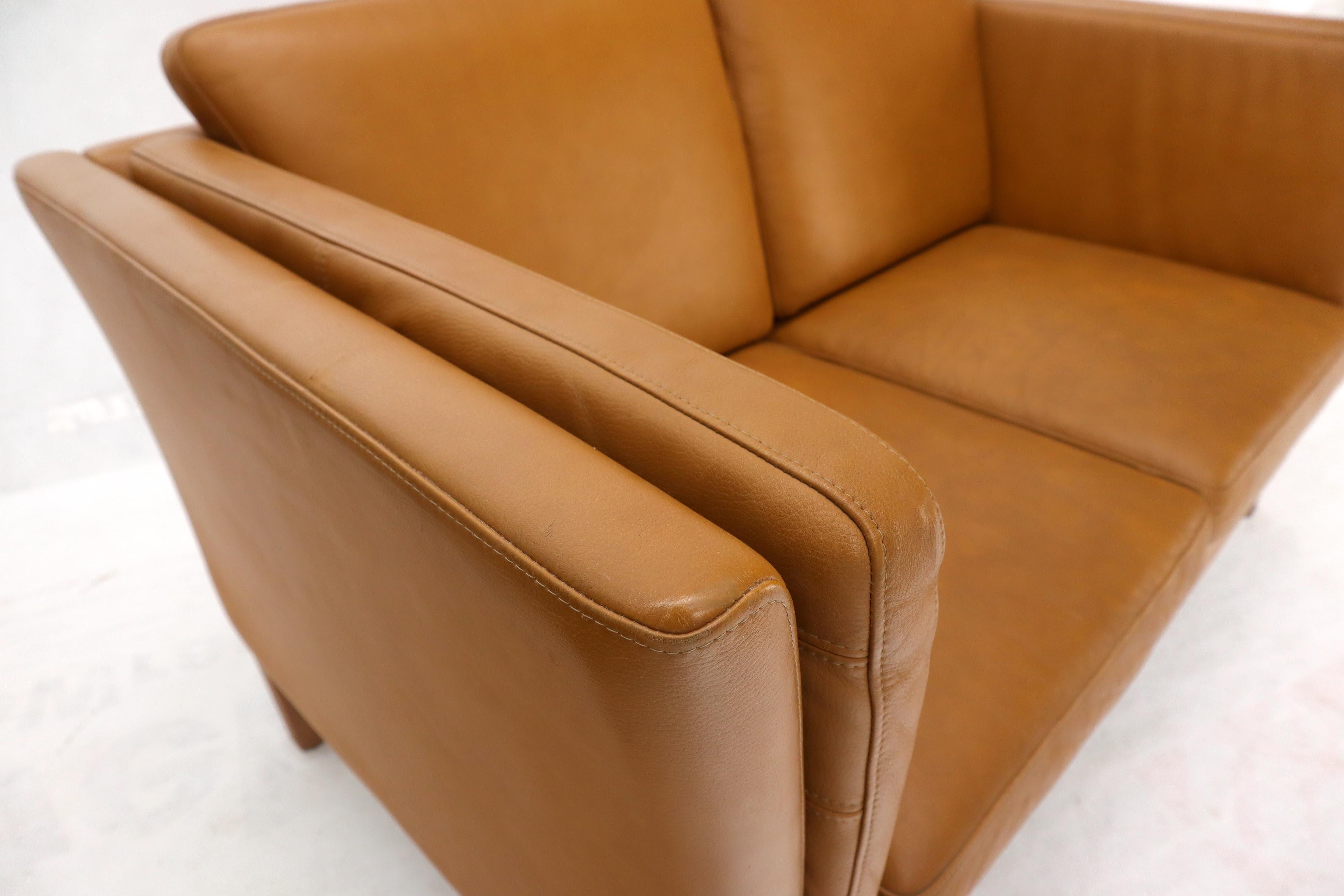 tan leather love seat