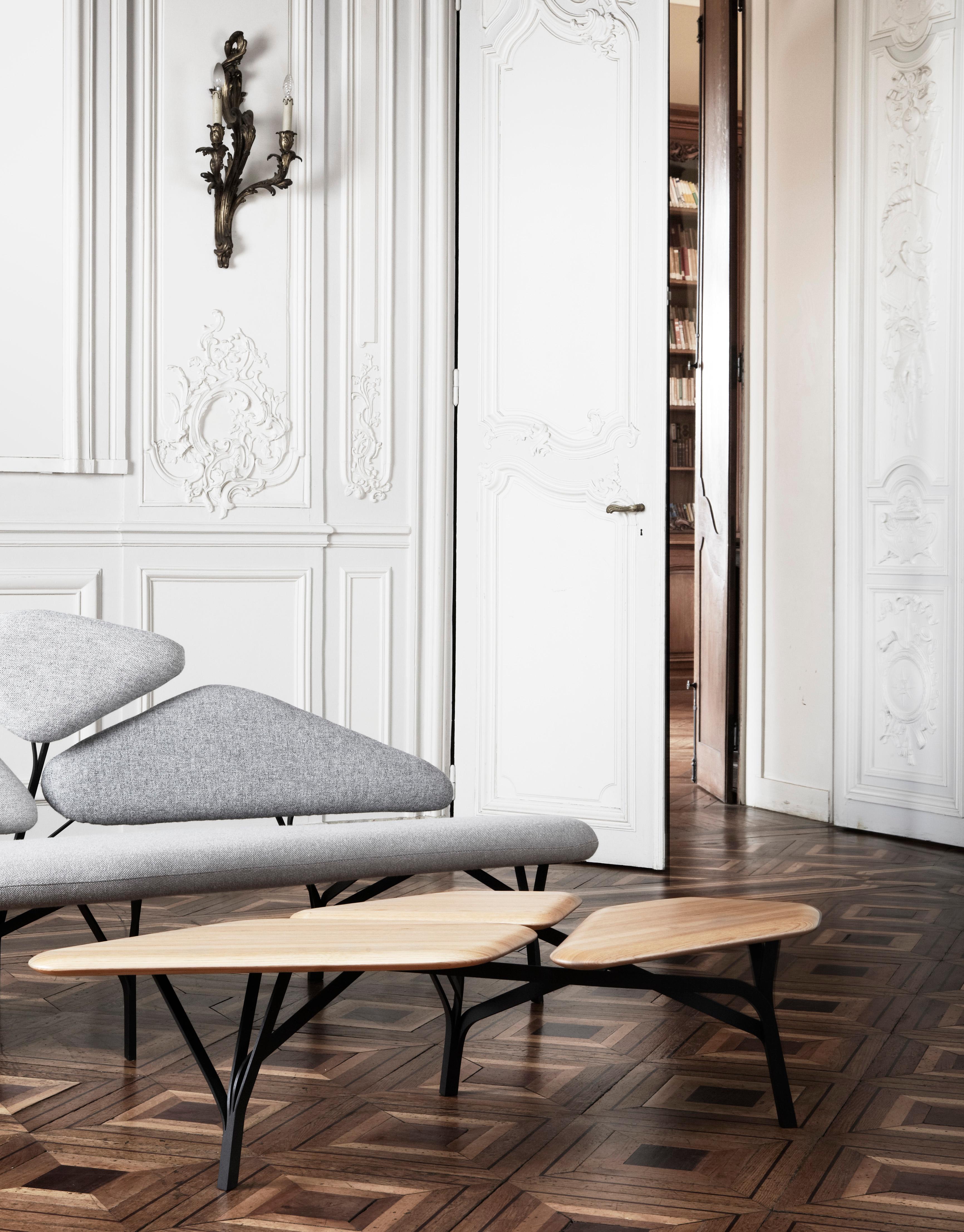 The Borghese table, as the eponymous sofa, is inspired by the umbrella pines at the Villa Borghese gardens in Rome.
The characteristic network of branches is translated as a graphic steel framework supporting a trio of solid wood tops.
The