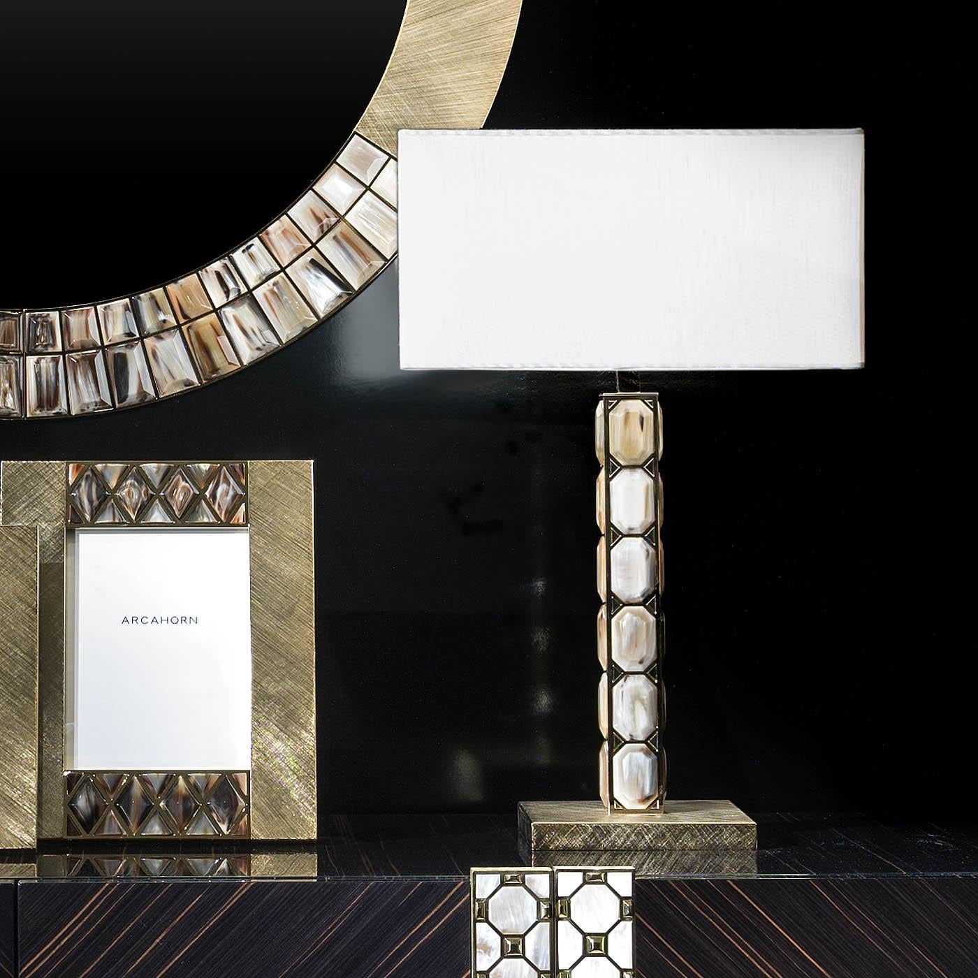 Borgia Table Lamp by Arcahorn
Dimensions: D 40 x W 40 x H 64 cm
Materials: Horn, brass.

Table lamp. Structure and base in hand engraved 24K gold plated brass. Raised rounded horn inlays. Lampshade in ivory shantung.

Colors and shades of horn