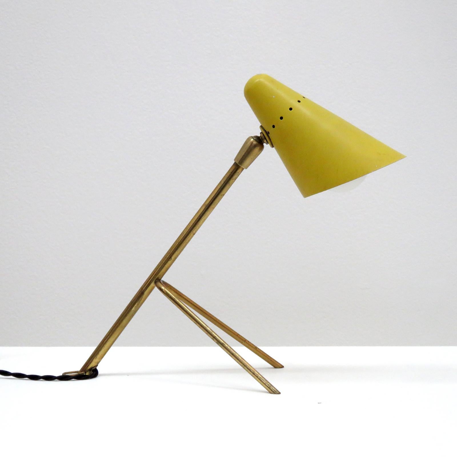 Petite table lamp by Boris Lacroix, brass frame with perforated, enameled hood with perforations, fully adjustable, can be used as a wall lamp.