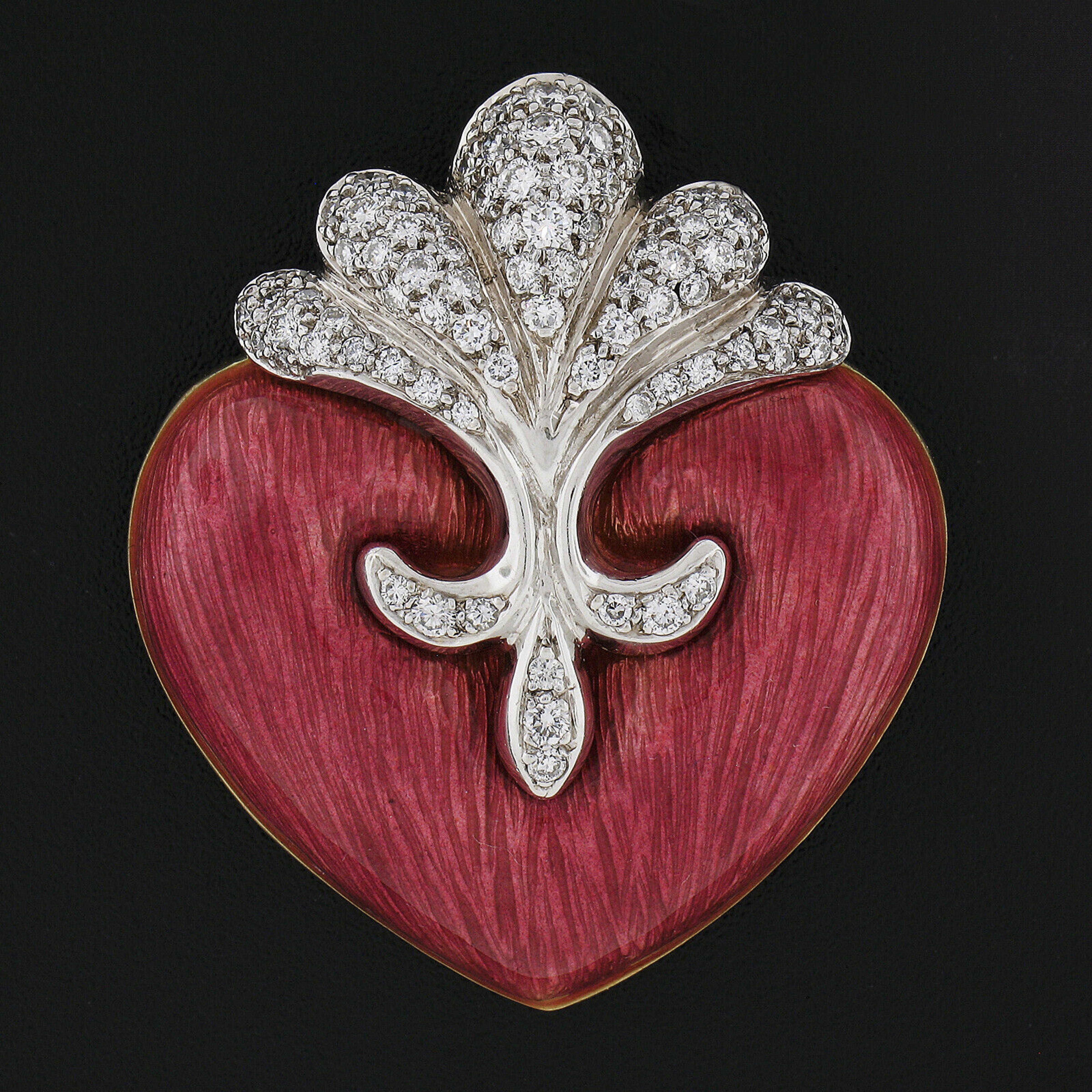 This outstanding brooch/pin is designed by Boris LeBeau and crafted in solid 18k yellow and white gold featuring a bold and beautiful heart design perfectly covered in enamel showing a unique pastel deep pink color in which is in absolutely mint