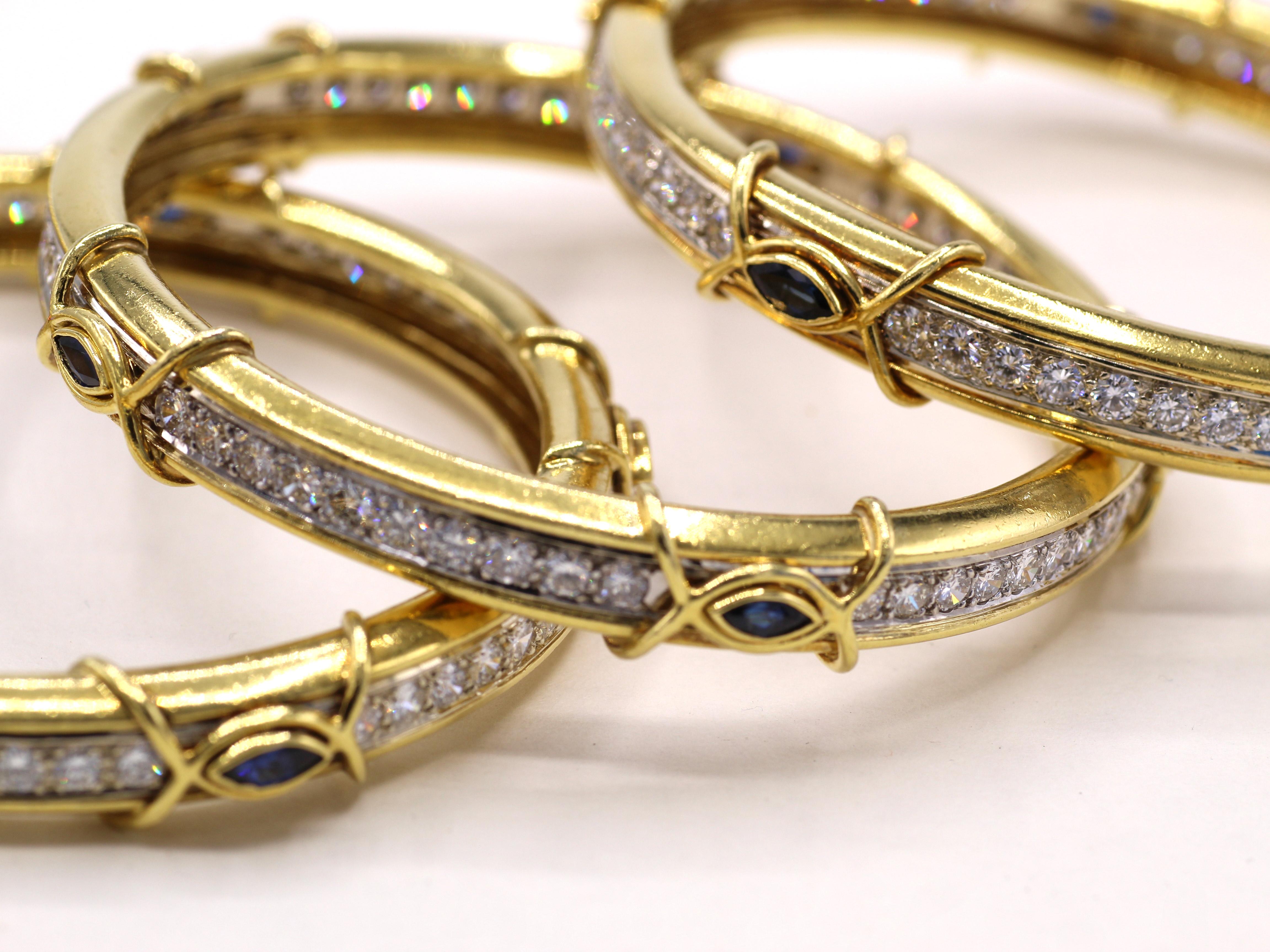 Beautifully designed and masterfully handcrafted in 18 karat gold, this set of 3 bangle bracelets by renown jeweler Boris Lebeau make for a chic, stylish and most wearable look on every wrist. Each bangle is set with a channel of 40 perfectly