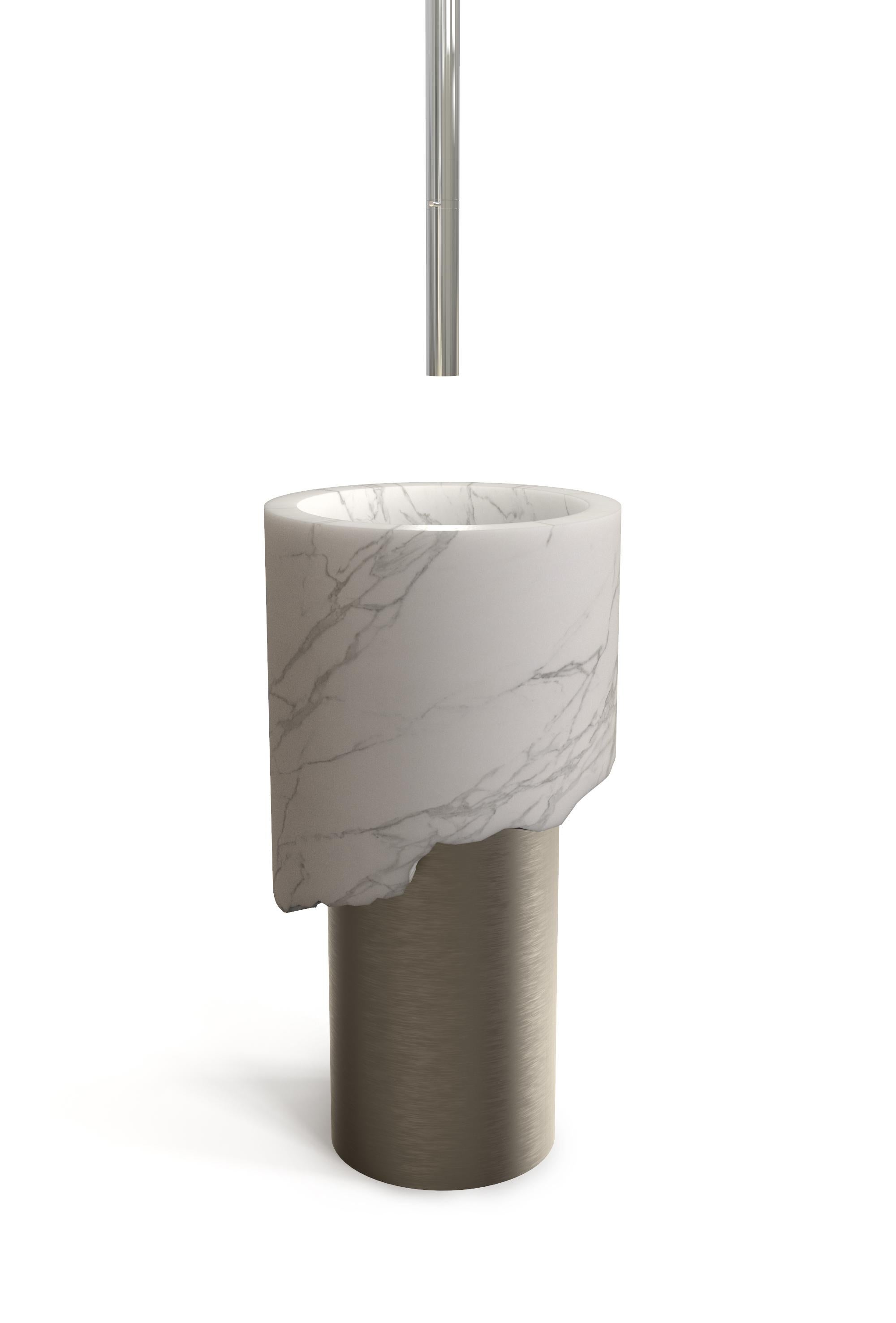 Boris washbasin by Marmi Serafini
Materials: Calcatta marble, bronze.
Dimensions: D 44 x H 85 cm
Available in other marbles and metals.
Tap not included.

Sculptural design, organic proportions and strong balance between materials.
These are