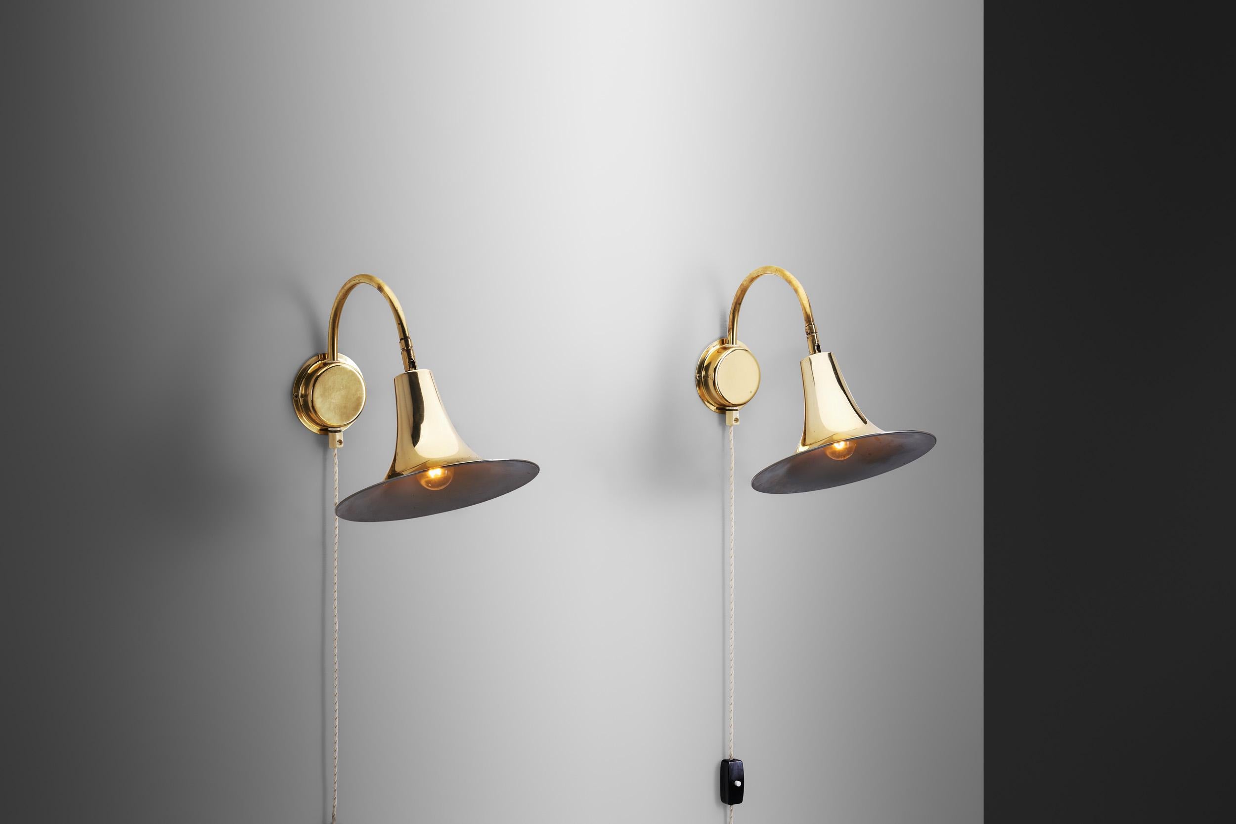 Swedish Modern, with its simplified lines and lack of excessive ornamentation, was a counter reaction to the earlier, more decorative design movements such as Art Deco. In comparison, as this pair of wall lamps demonstrates, the mid-century era