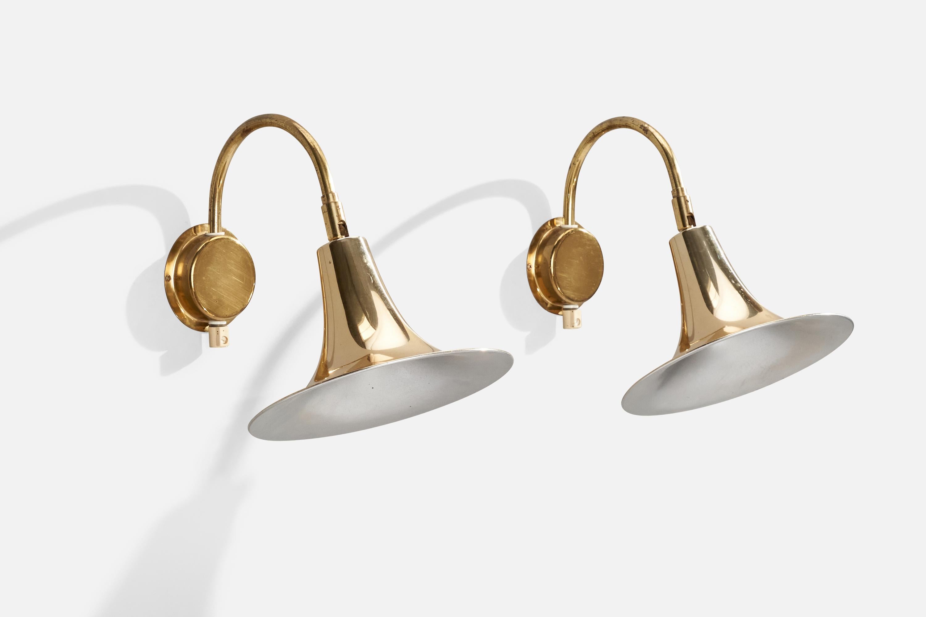 A pair of adjustable brass wall lights designed by Börje Claes and produced by Norlett, Sweden, c. 1970s.

Overall Dimensions (inches): 11.75” H x 9.5” W x 13.75” D
Back Plate Dimensions (inches): 4” H x 4”  W x .75” D
Bulb Specifications: E-26
