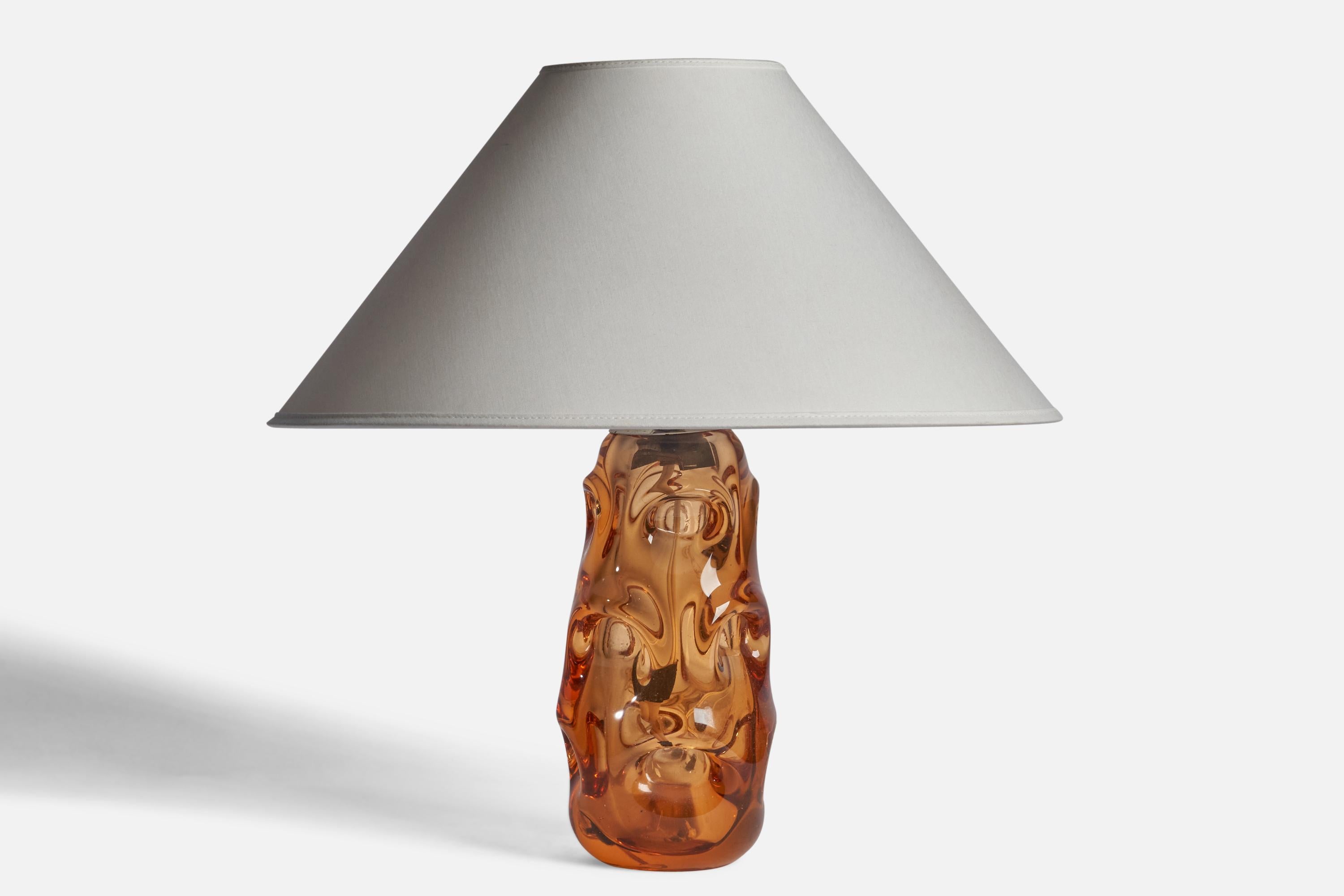 An orange-coloured blown glass table lamp designed by Börne Augustsson and produced by Åseda Glasbruk, Sweden, 1940s.

Dimensions of Lamp (inches): 11.35” H x 4.25” Diameter
Dimensions of Shade (inches): 4.5” Top Diameter x 16” Bottom Diameter x