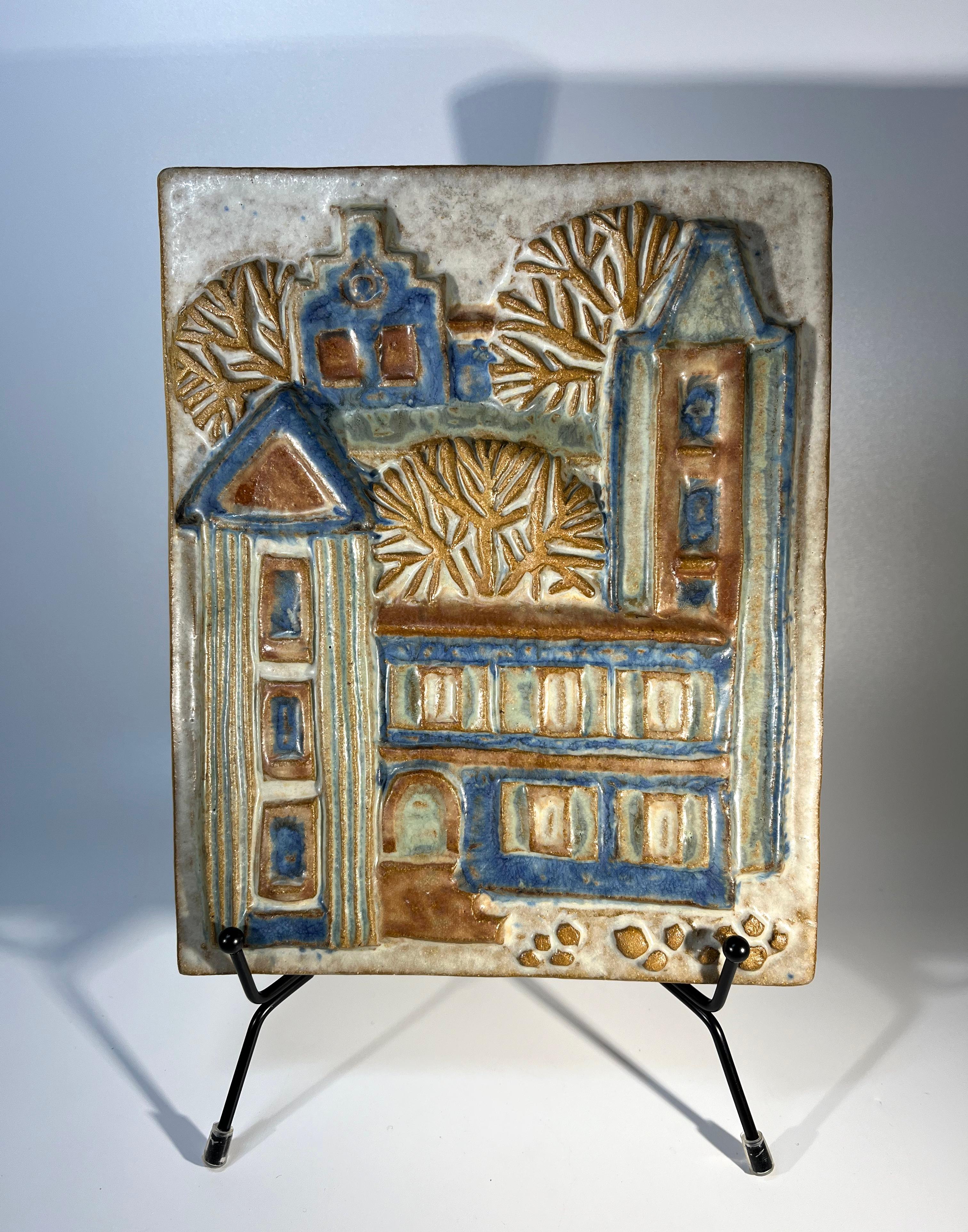 Delightful Bornholm wall plaque by Marianne Starck for Michael Andersen, Denmark 
Soft tones of blues and browns on hand crafted stoneware
Stamped MS, Three Herrings mark, Bornholm and #6169 on reverse
Width 7 inch, Height 8.5 inch, Depth 1