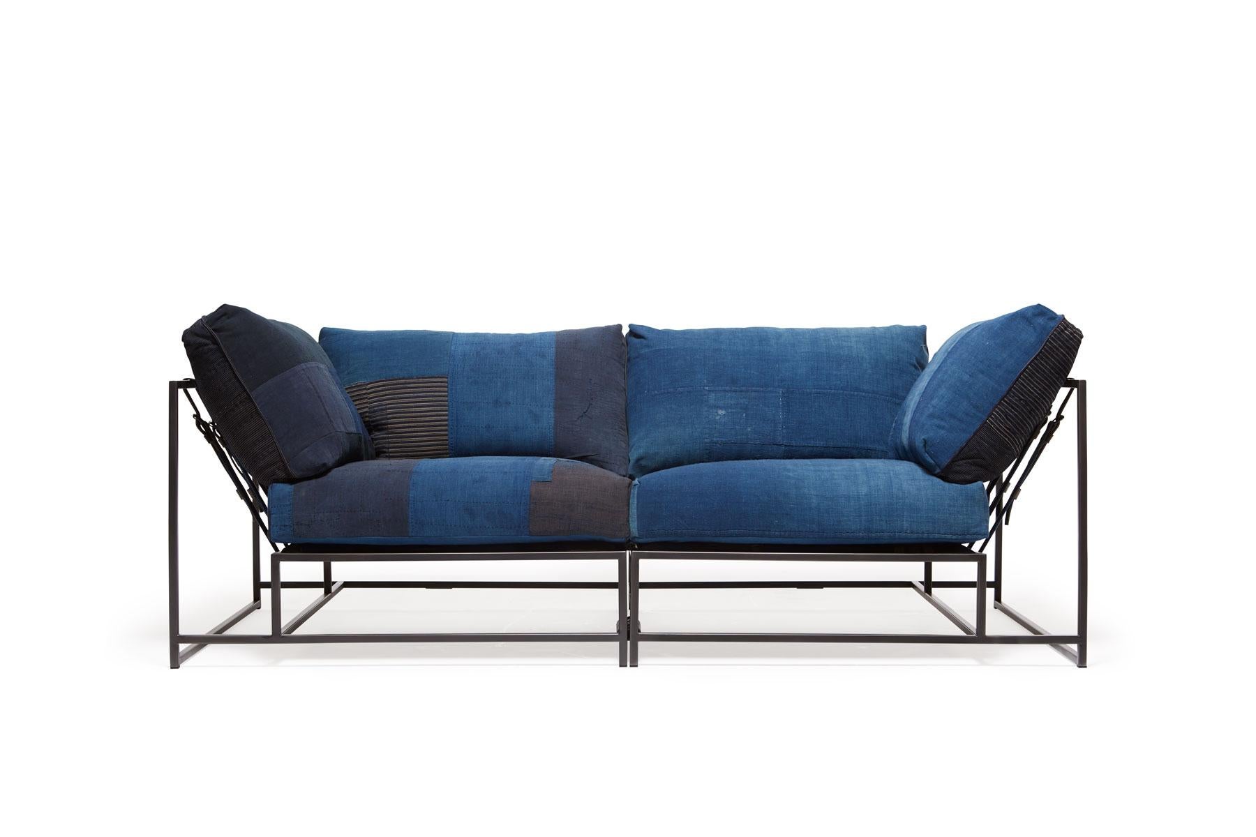 The Inheritance Two Seat Sofa by Stephen Kenn is as comfortable as it is unique. The design features an exposed construction composed of three elements - a steel frame, plush upholstery, and supportive belts. The deep seating area is perfect for a