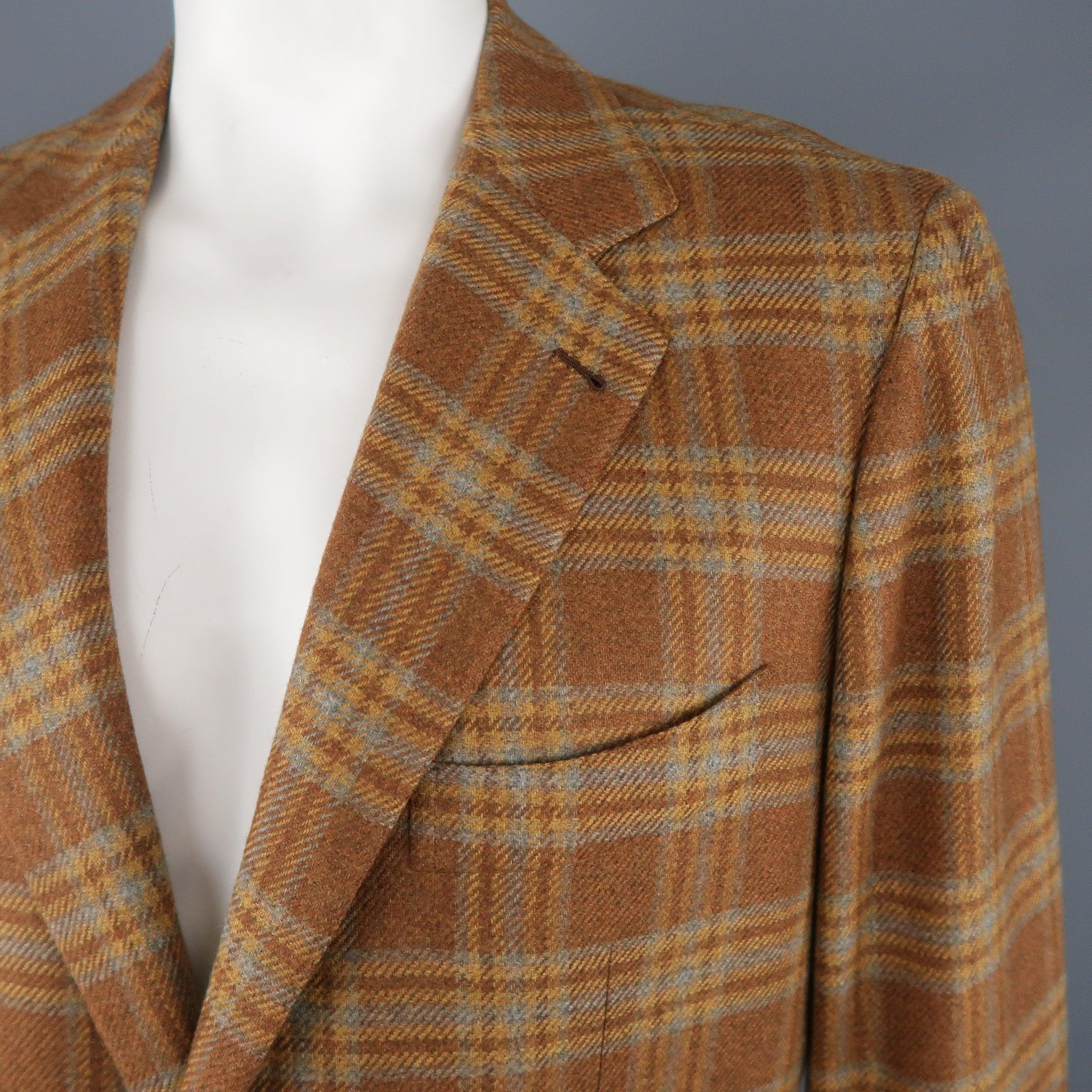 BORRELLI sport coat comes in light brown, blue & gold plaid cashmere with a notch lapel, two button, single breasted front, and flap pockets. Made in Italy.Excellent Pre-Owned Condition. 

Marked:   SM 

Measurements: 
 
Shoulder: 18.5 inches Chest: