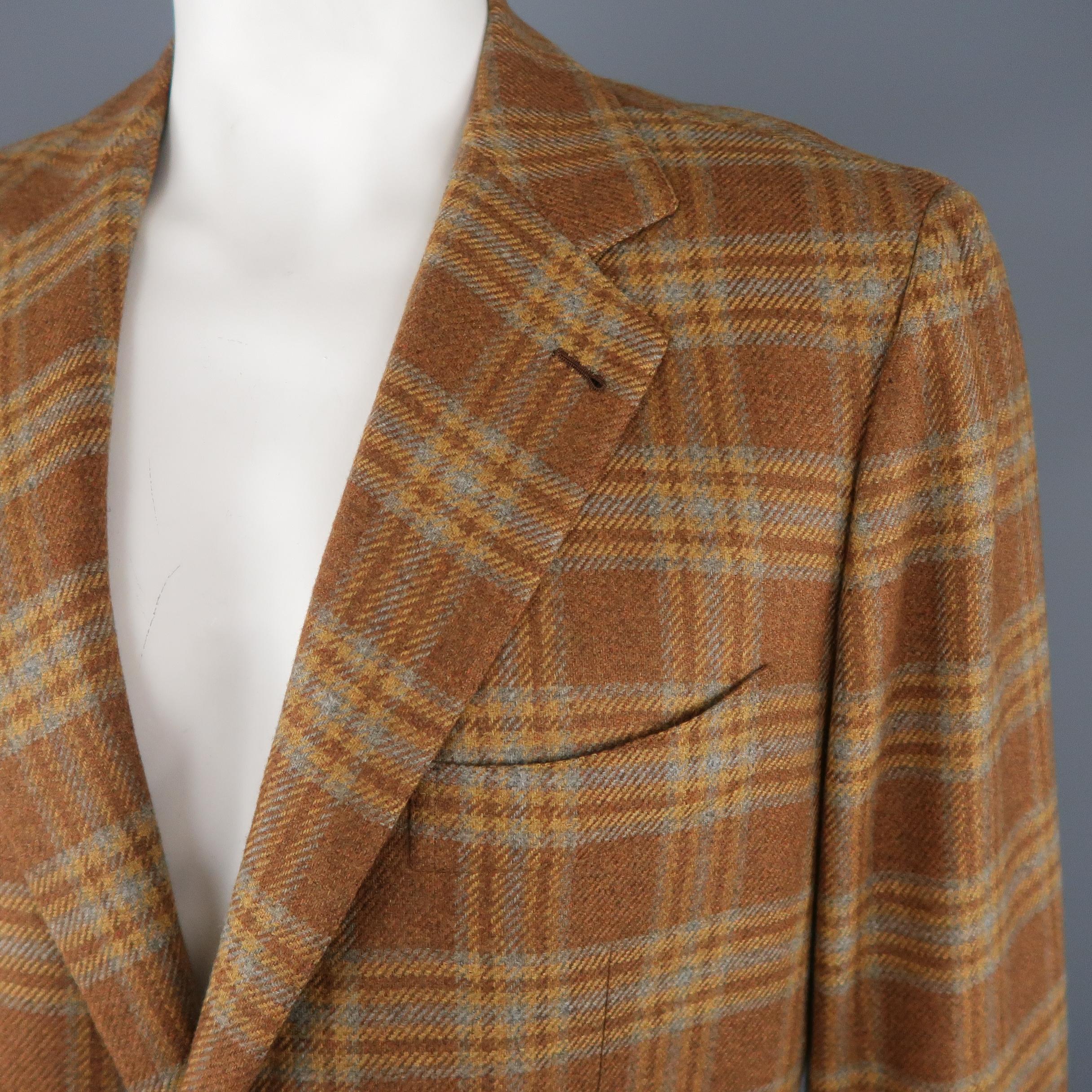 BORRELLI sport coat comes in light brown, blue & gold plaid cashmere with a notch lapel, two button, single breasted front, and flap pockets. Made in Italy.
 
Excellent Pre-Owned Condition.
Marked: SM
 
Measurements:
 
Shoulder: 18.5 in.
Chest: 46