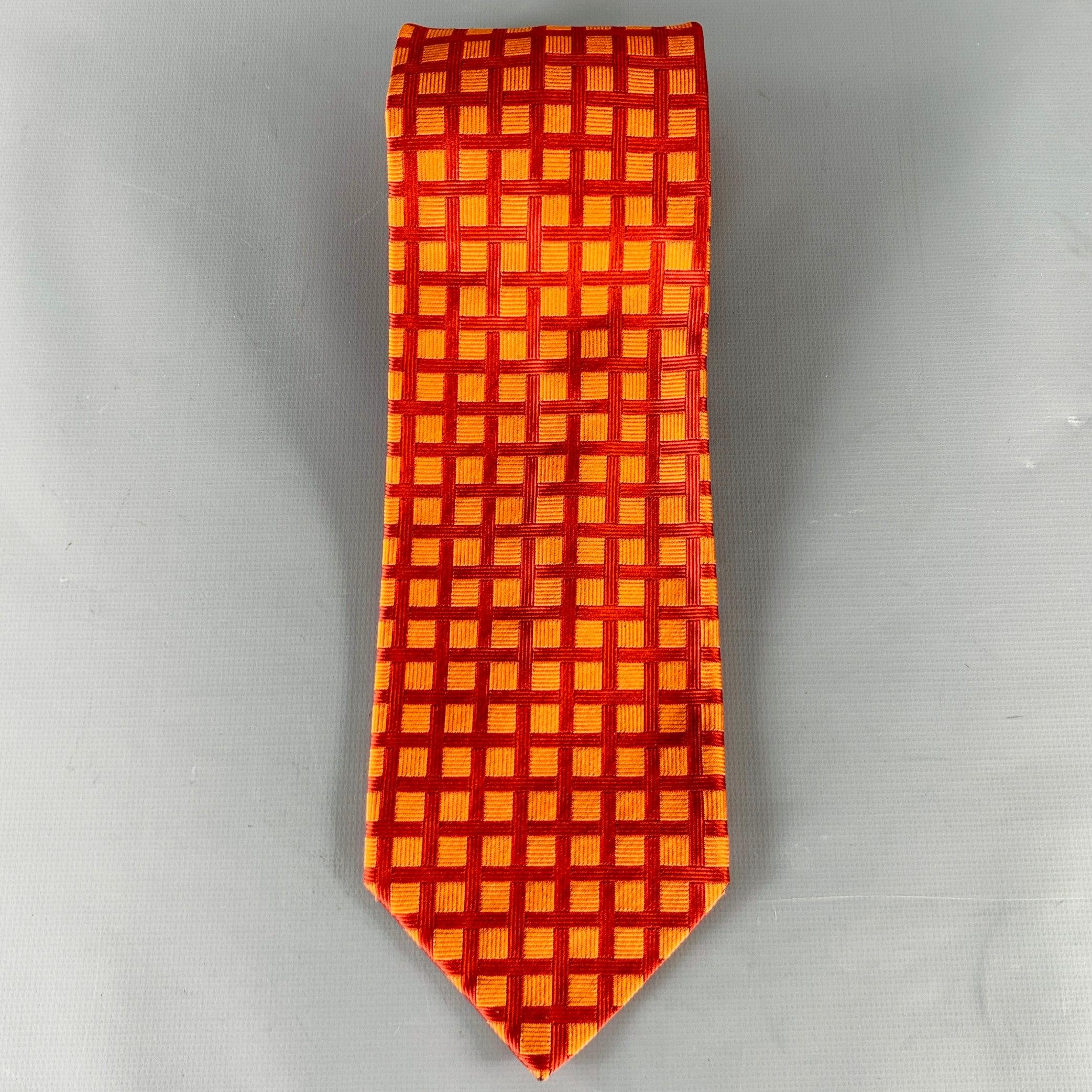 BORELLI
necktie in
an orange and red silk jacquard featuring a checkered pattern. Handmade in Italy.Very Good Pre-Owned Condition. 

Measurements: 
  Width: 3.5 inches Length: 60 inches 
  
  
 
Sui Generis Reference: 131096
Category: Tie
More